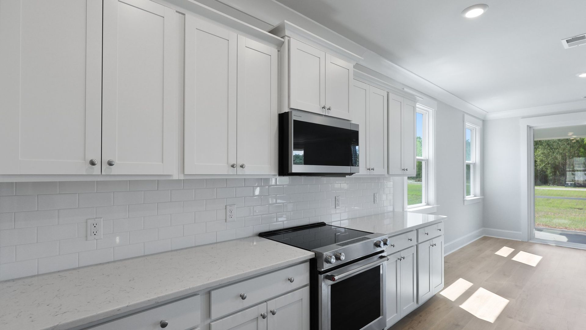 There is lots of cabinet space in the kitchen which also features a backsplash.