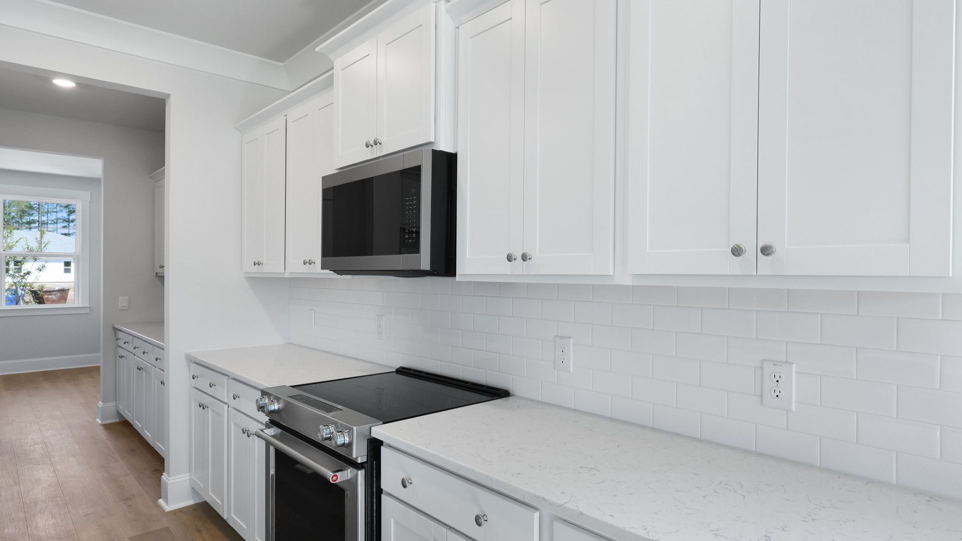 There is ample counterspace in the kitchen that also features an island with room for barstools.