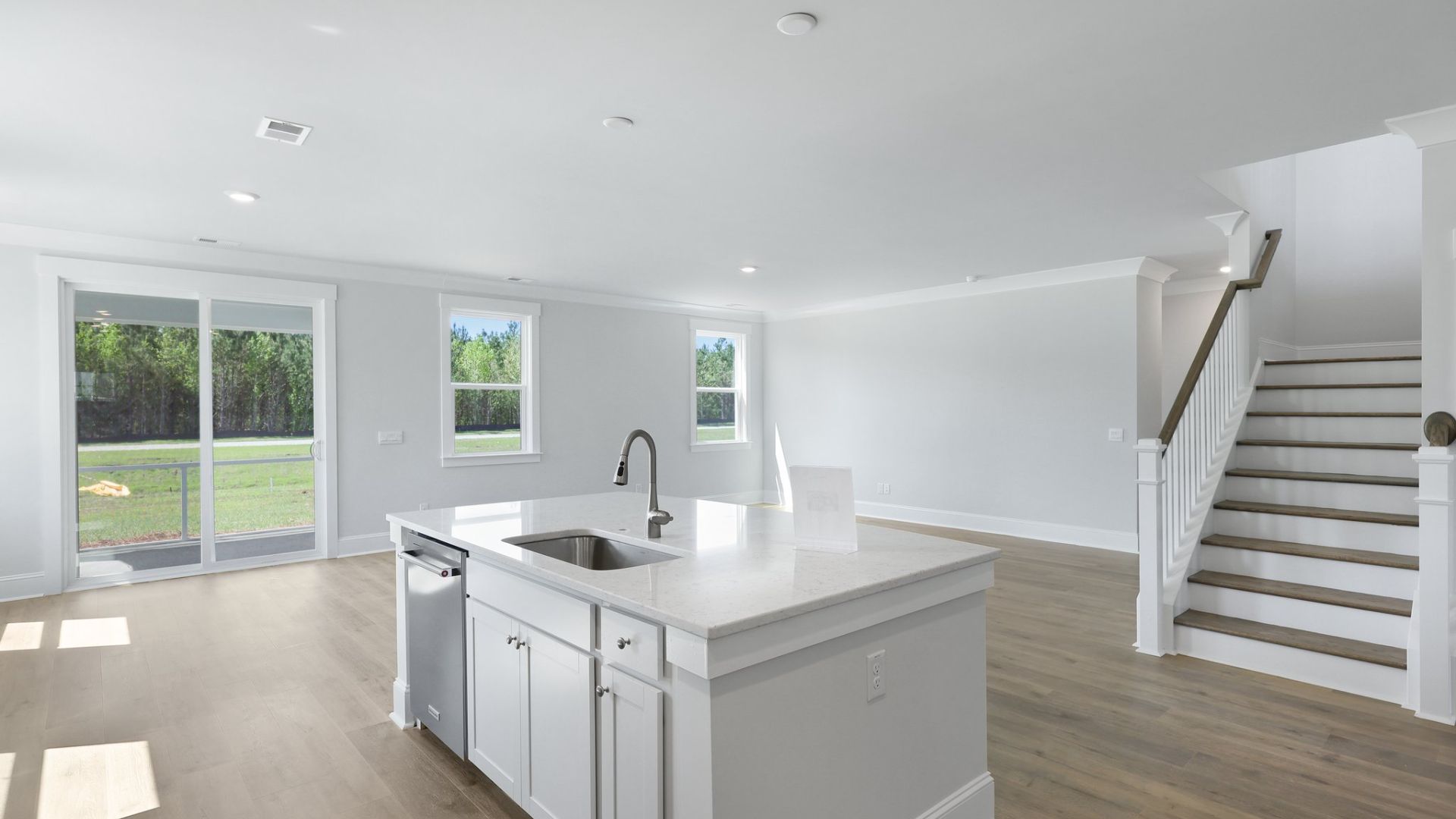 There is ample natural light in the kitchen and dining room from the sliding glass doors and windows.