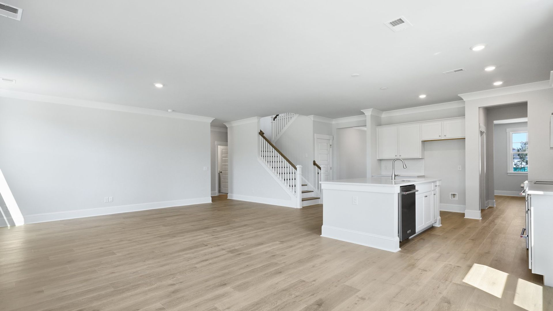 The kitchen,living and dining rooms are open concept with natural lighting.