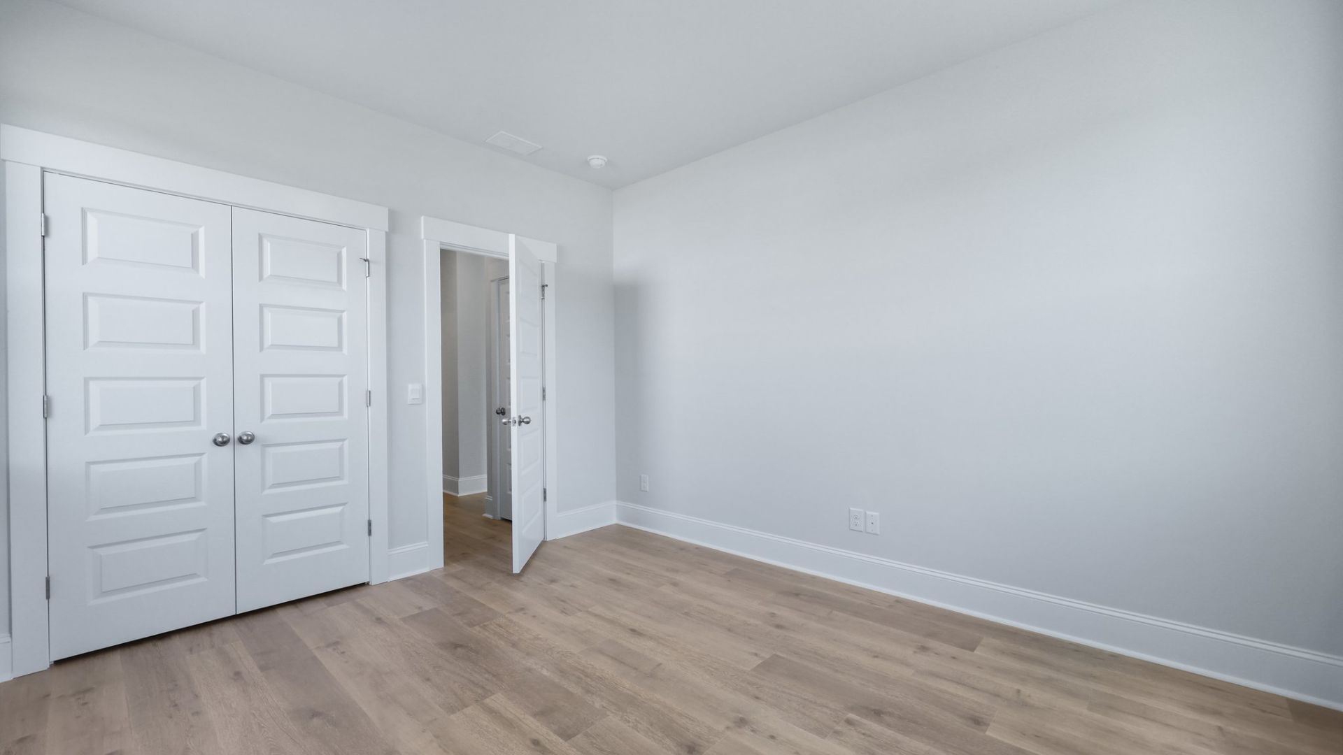 Bedroom 4 is located downstairs and has revwood flooring.