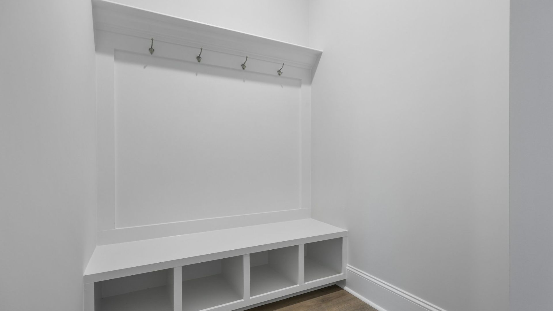 Coat hooks and storage space for shoes located downstairs