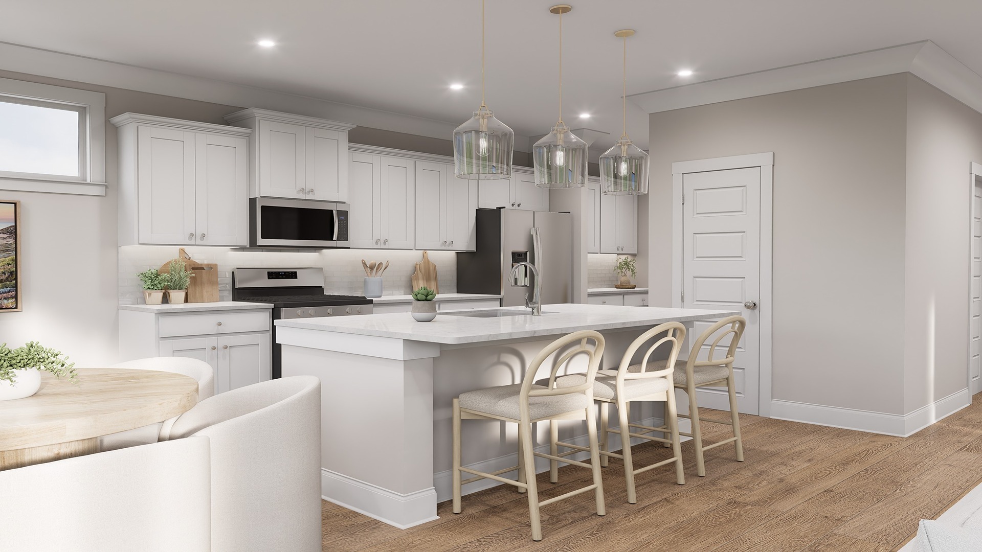 Barstool seating and a kitchen overlooking the living room.