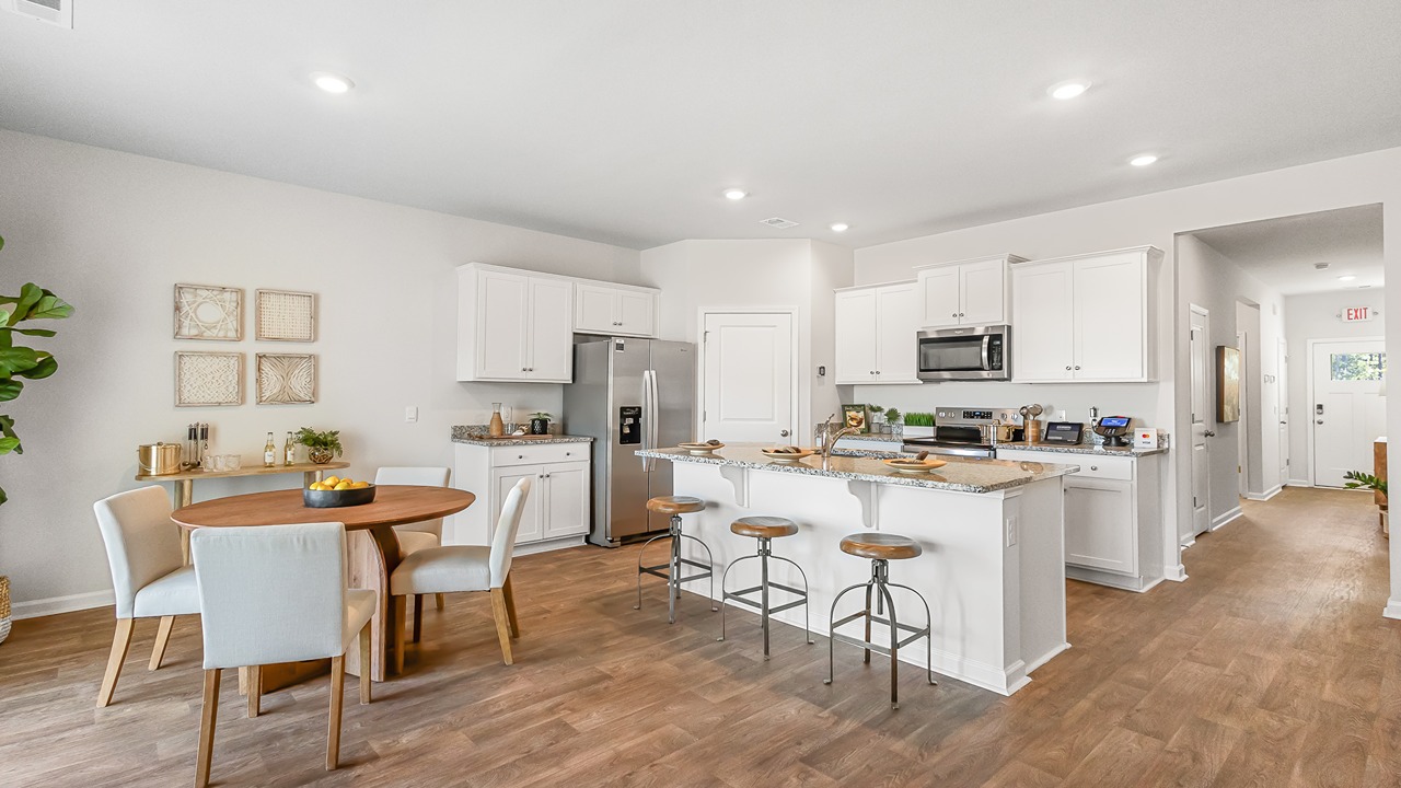 Staged model home dining room and kitchen