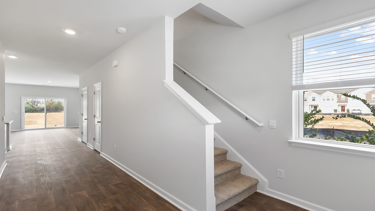spacious entry way to a two story townhome
