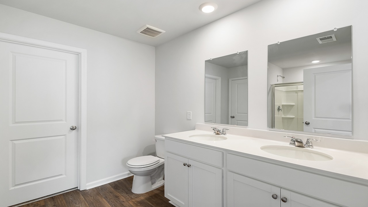 Primary bedroom with dual vanity