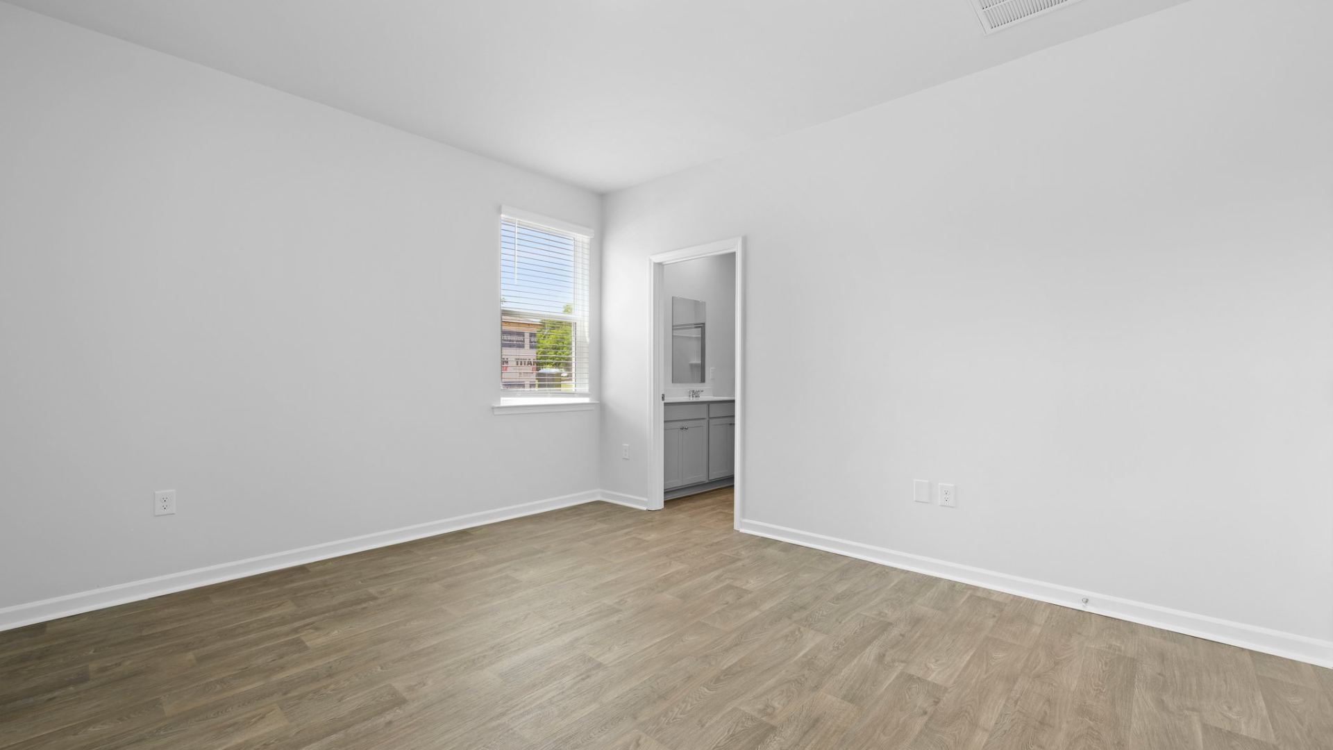 There is an ensuite bathroom and walk-in closet in the primary bedroom.