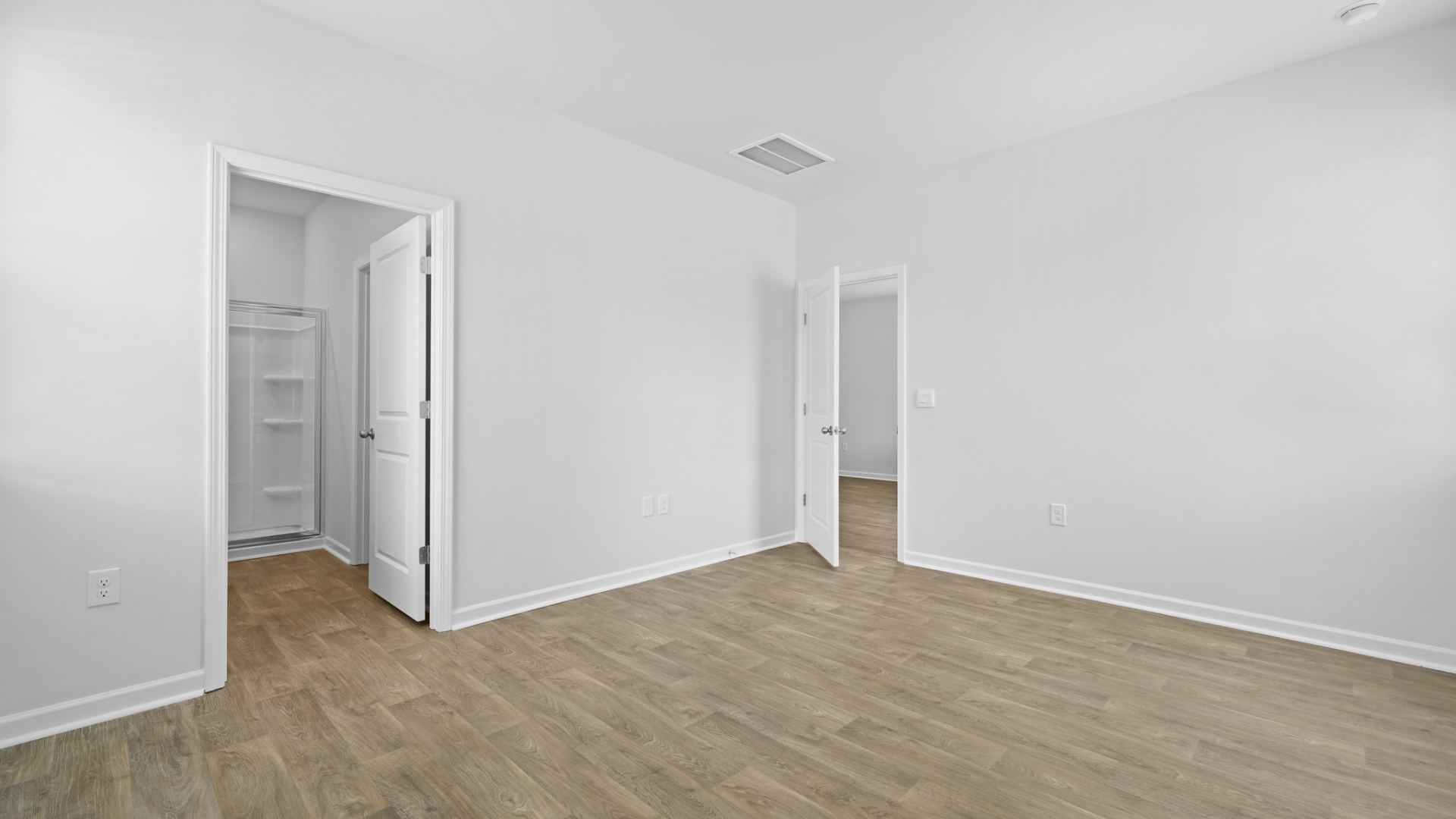 Bright and spacious primary bedroom.