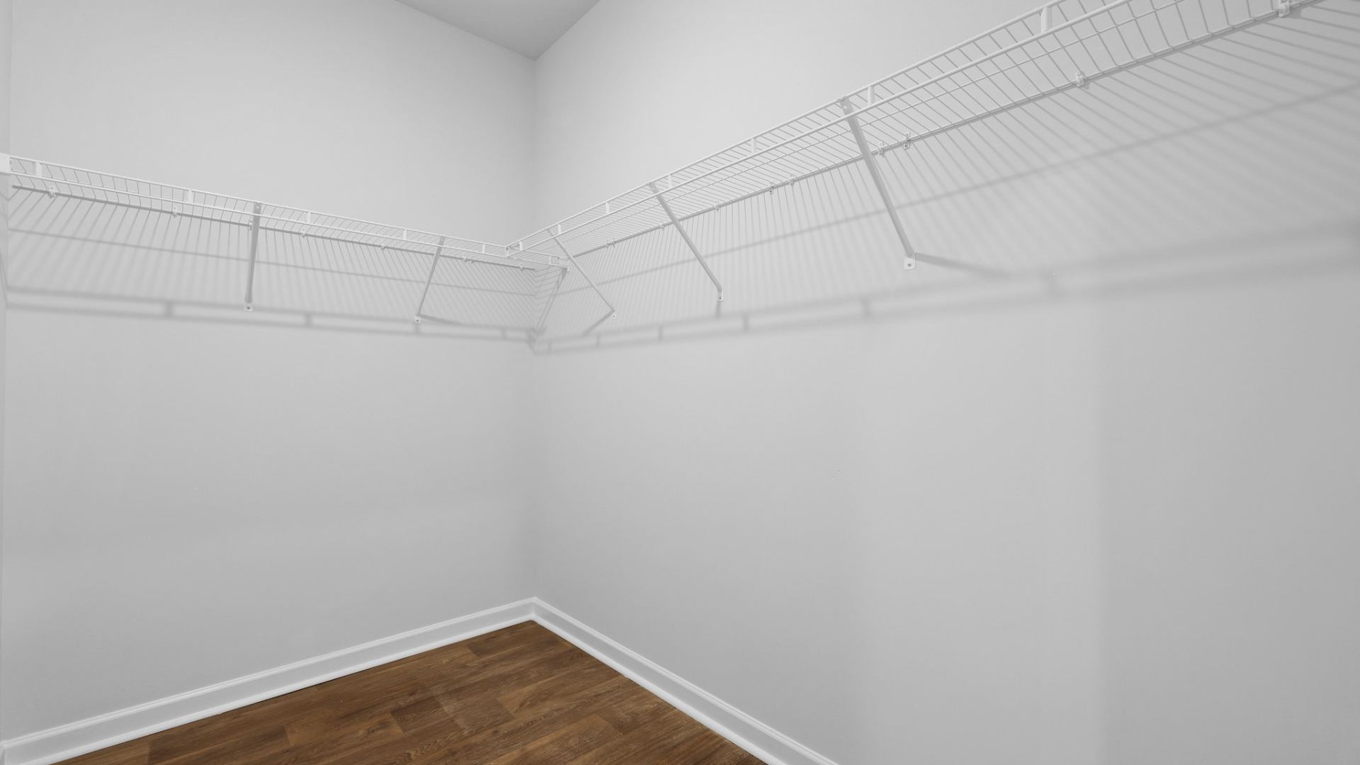 Spacious walk-in closet located in the primary bedroom.