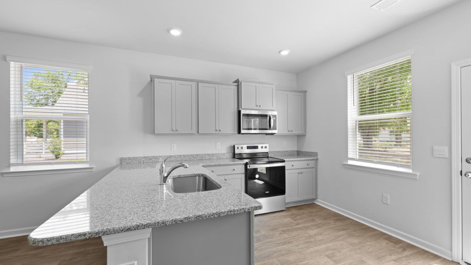 Spacious countertops and ample cabinet space in the kitchen of the Perry floorplan.