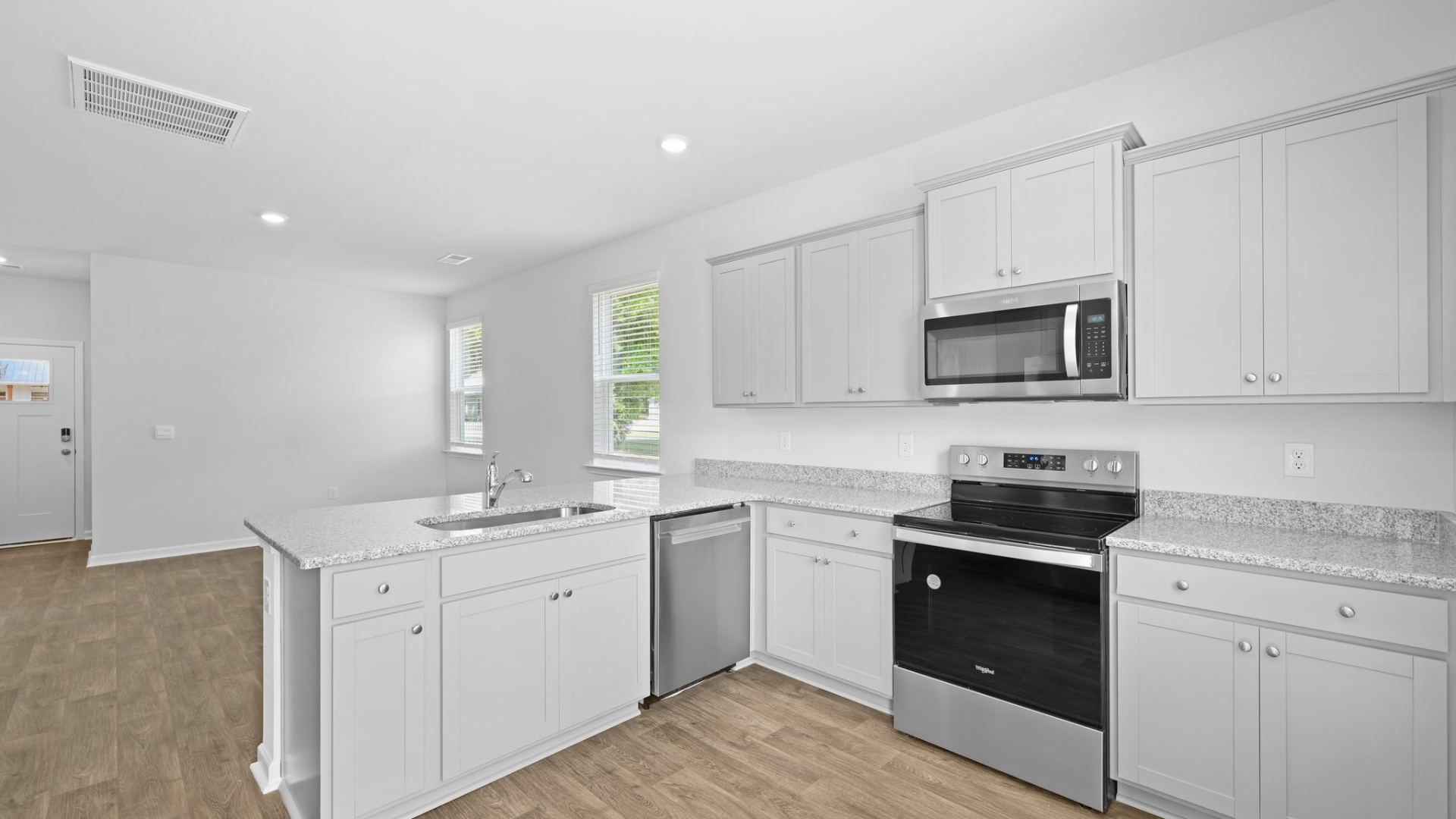 The kitchen overlooks the living room and dining room.