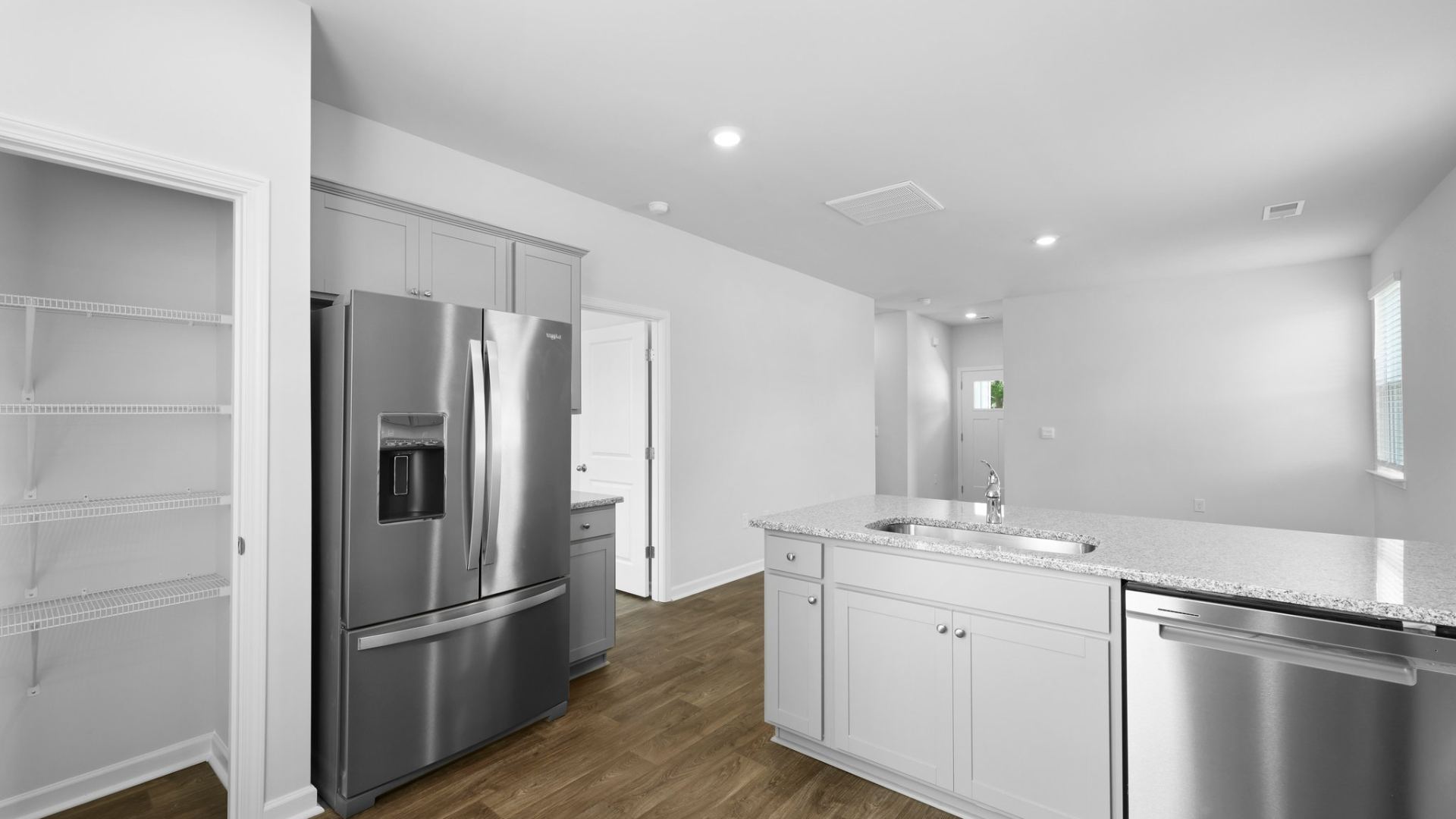 Open concept living room, dining room and kitchen.