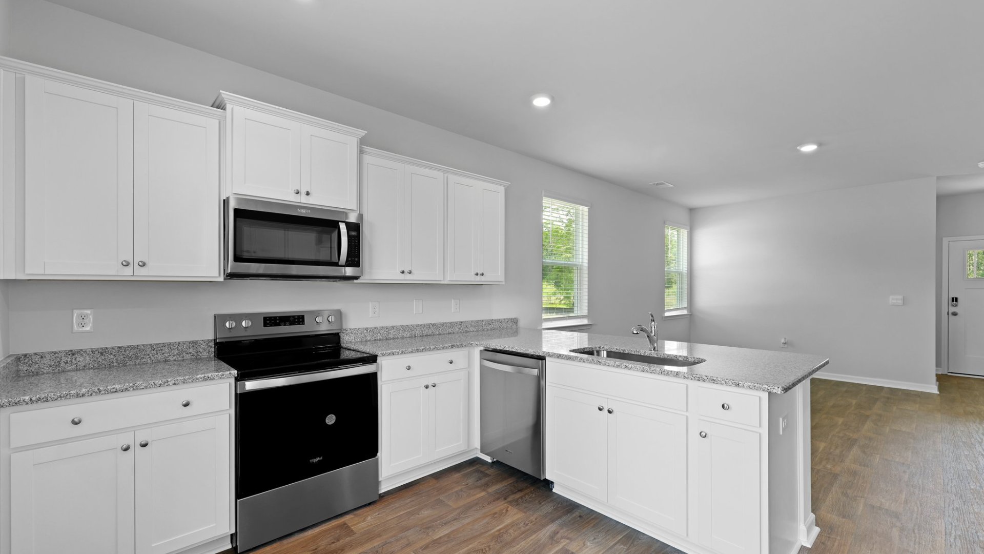 Spacious countertops and lots of cabinet storage in the kitchen.