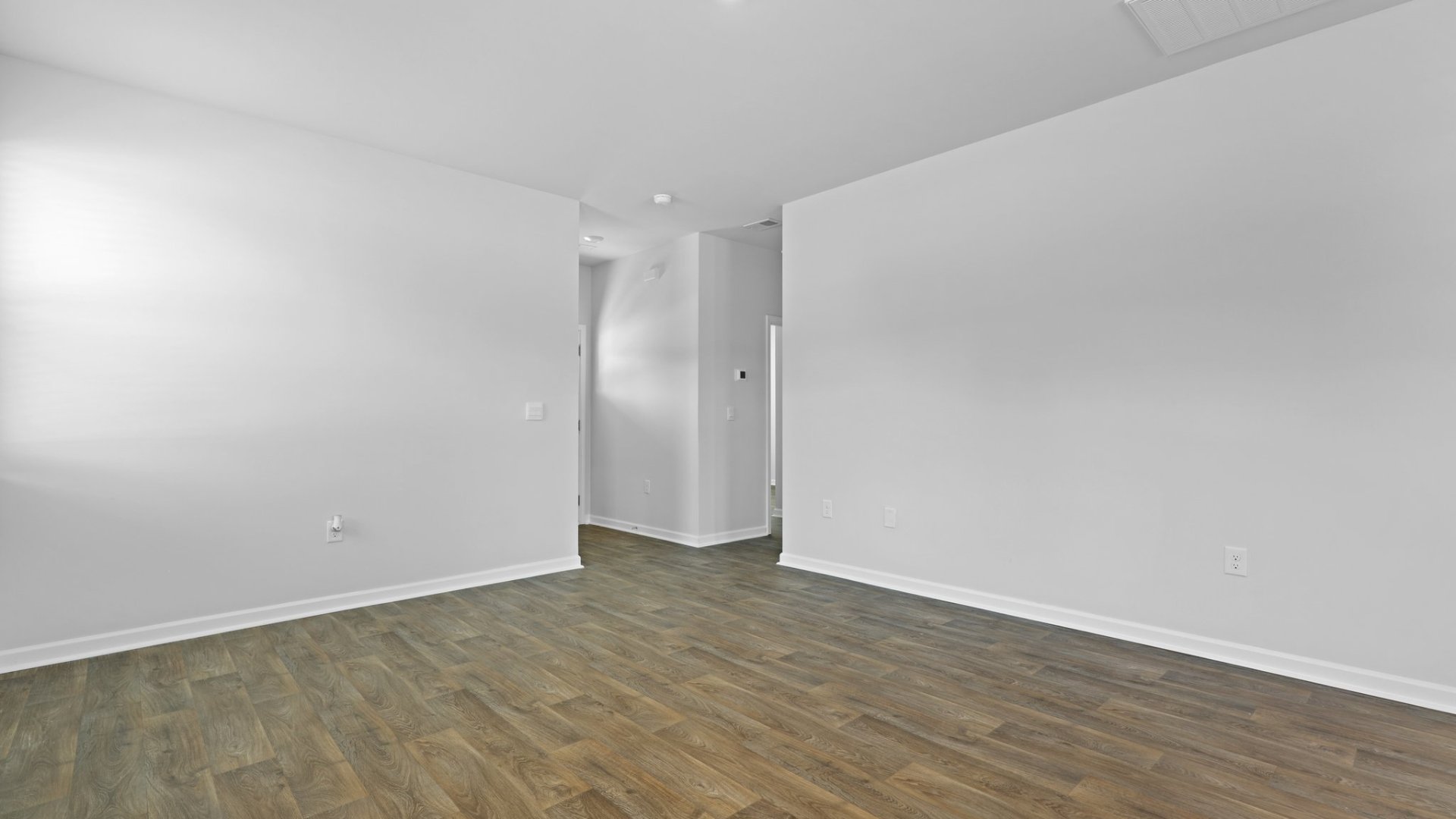 The entry way leads to the bright living room.