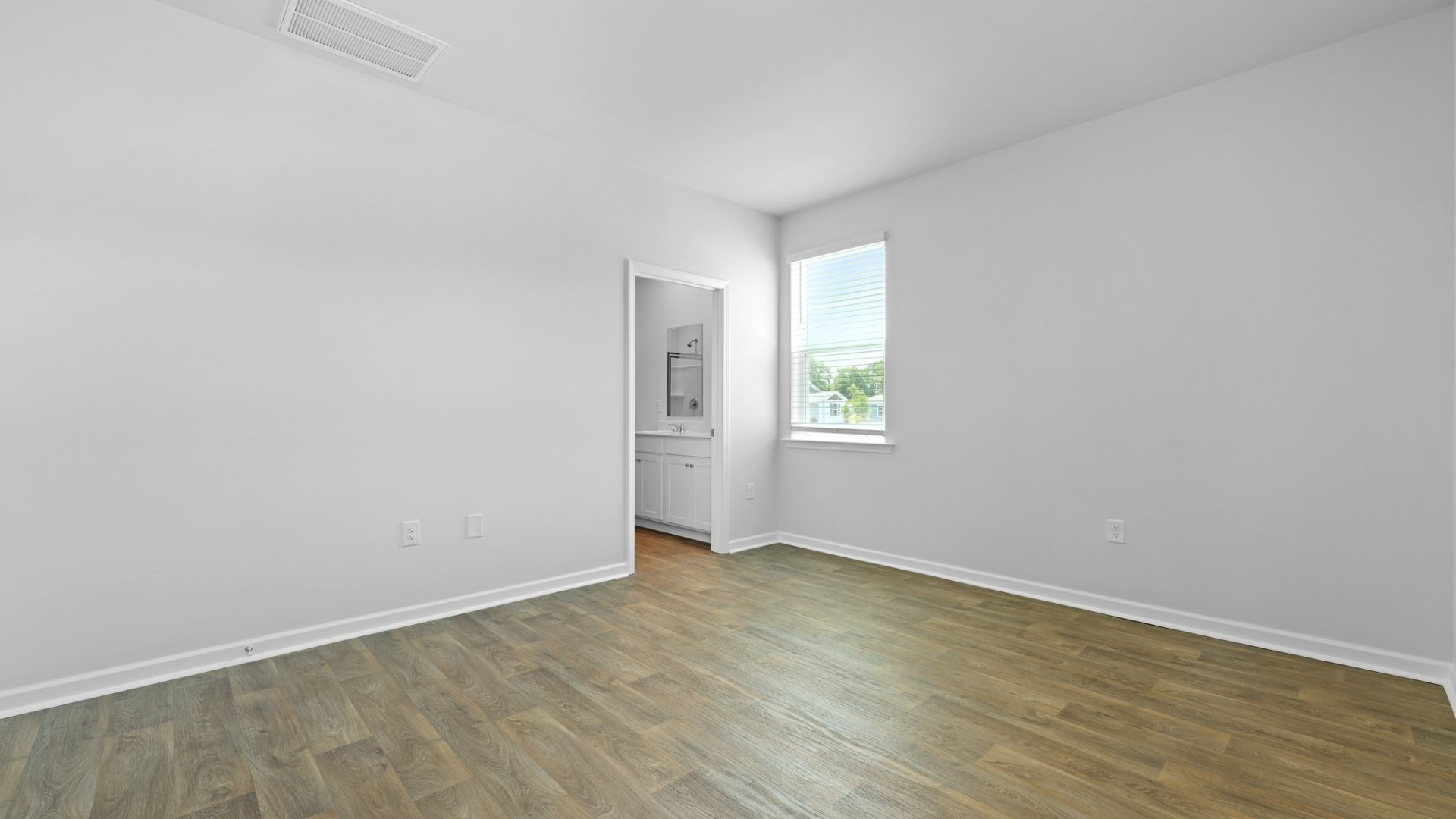 The primary bathroom is located in the primary bedroom.