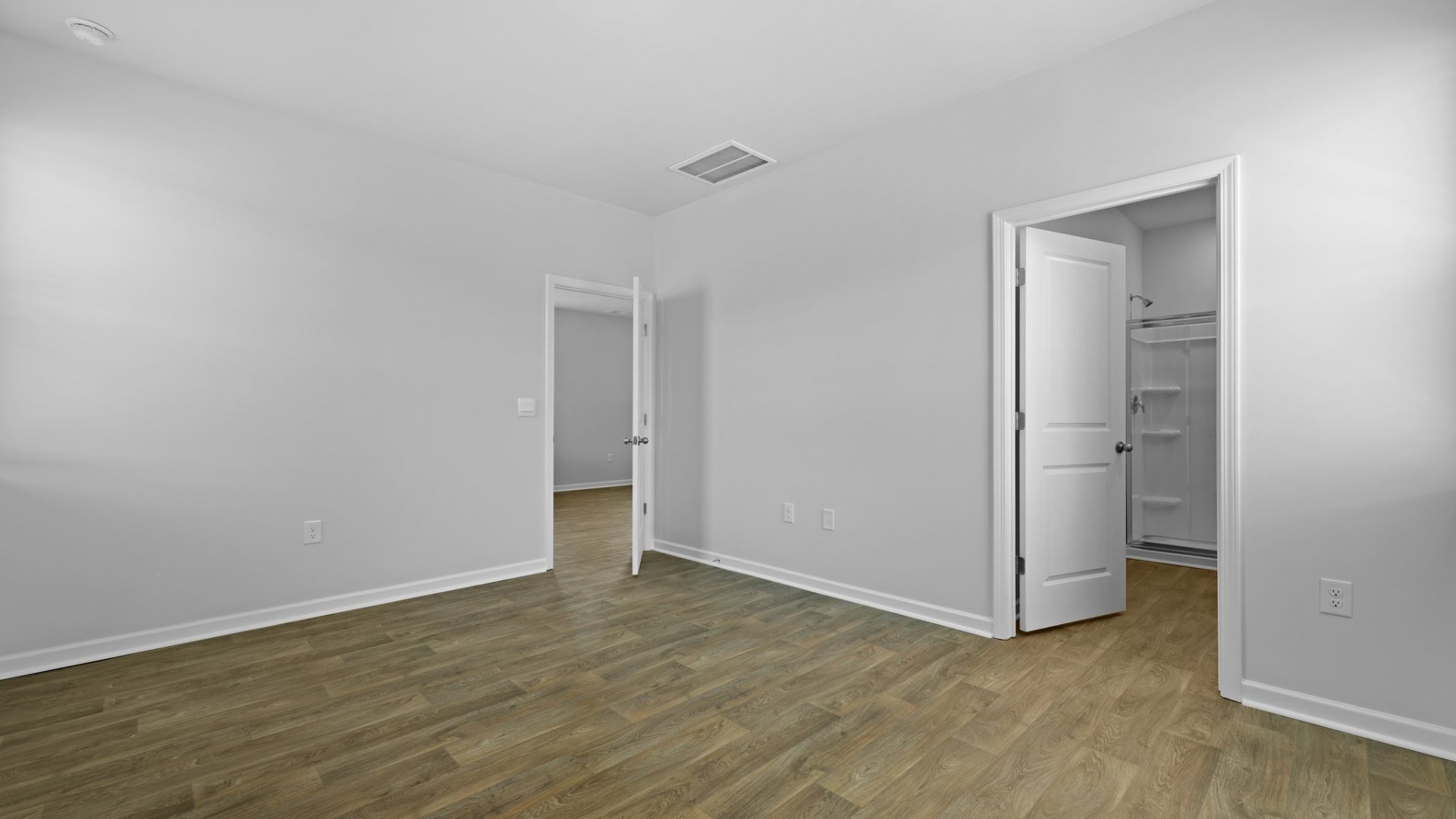 Ensuite walk-in closet and bathroom.