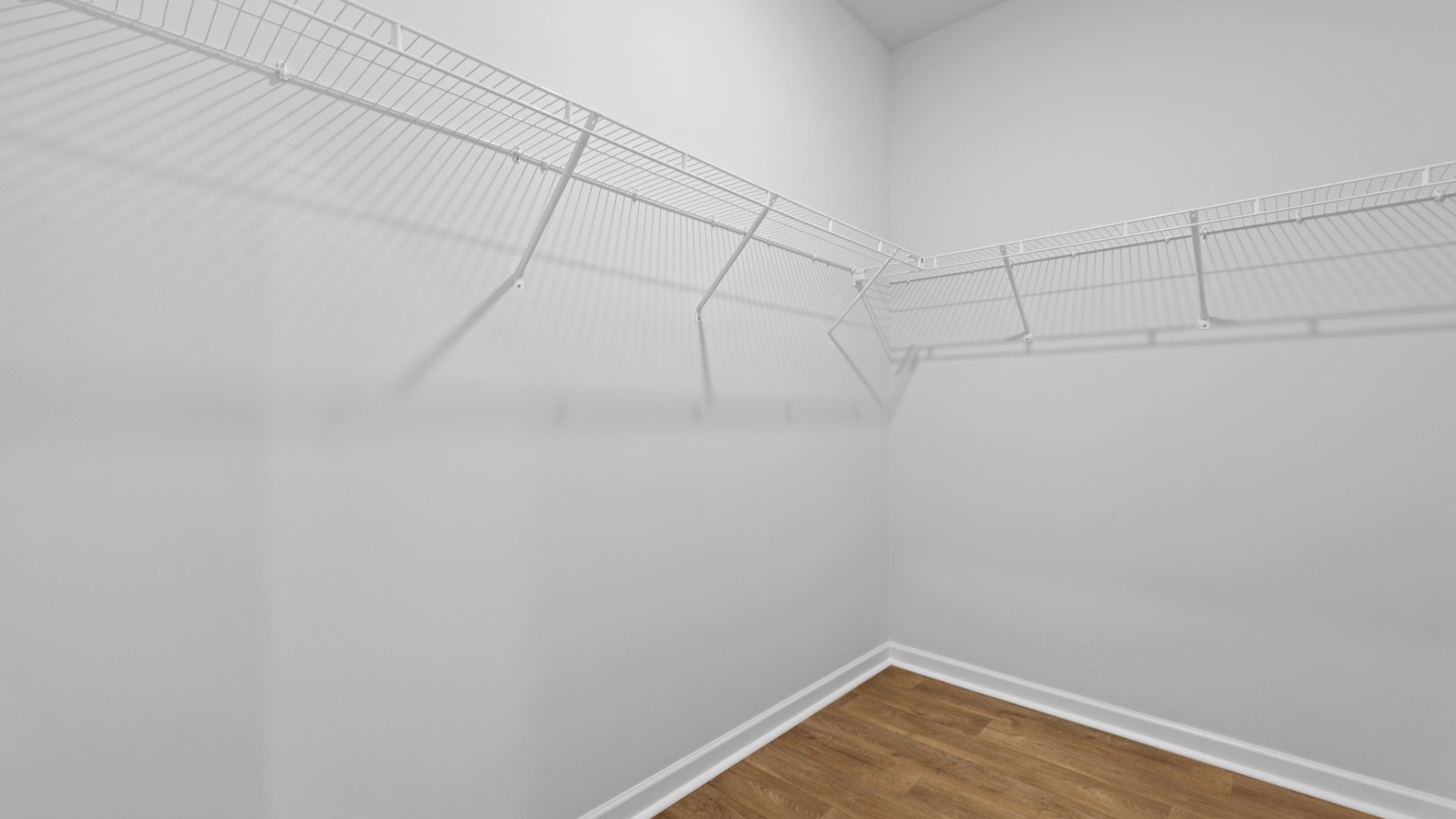 Walk-in closet located in the primary bedroom.