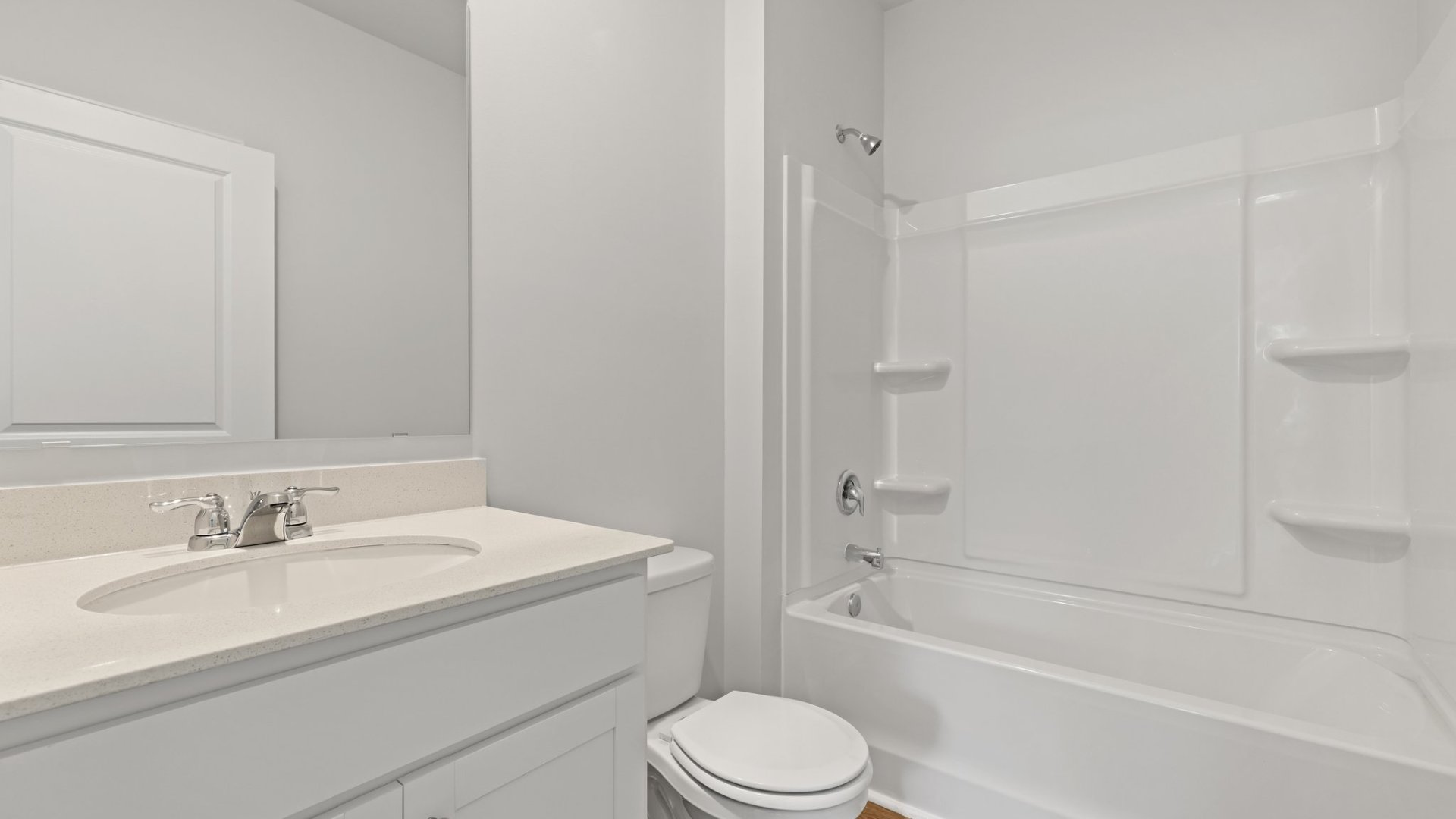 Bathroom 2 with a tub-shower combo and spacious vanity.