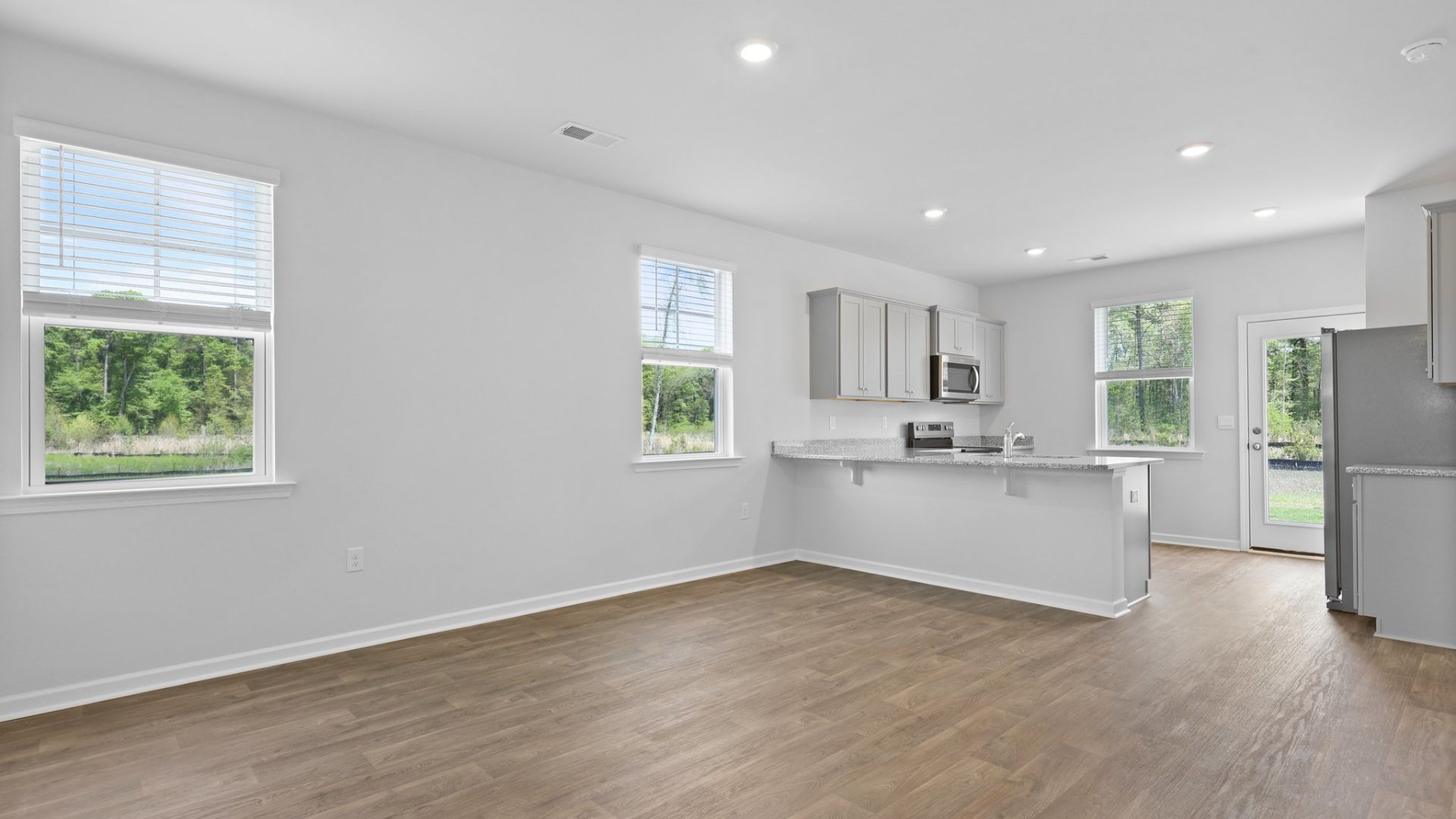 The Perry floorplan has a spacious and bright kitchen with a peninsula.