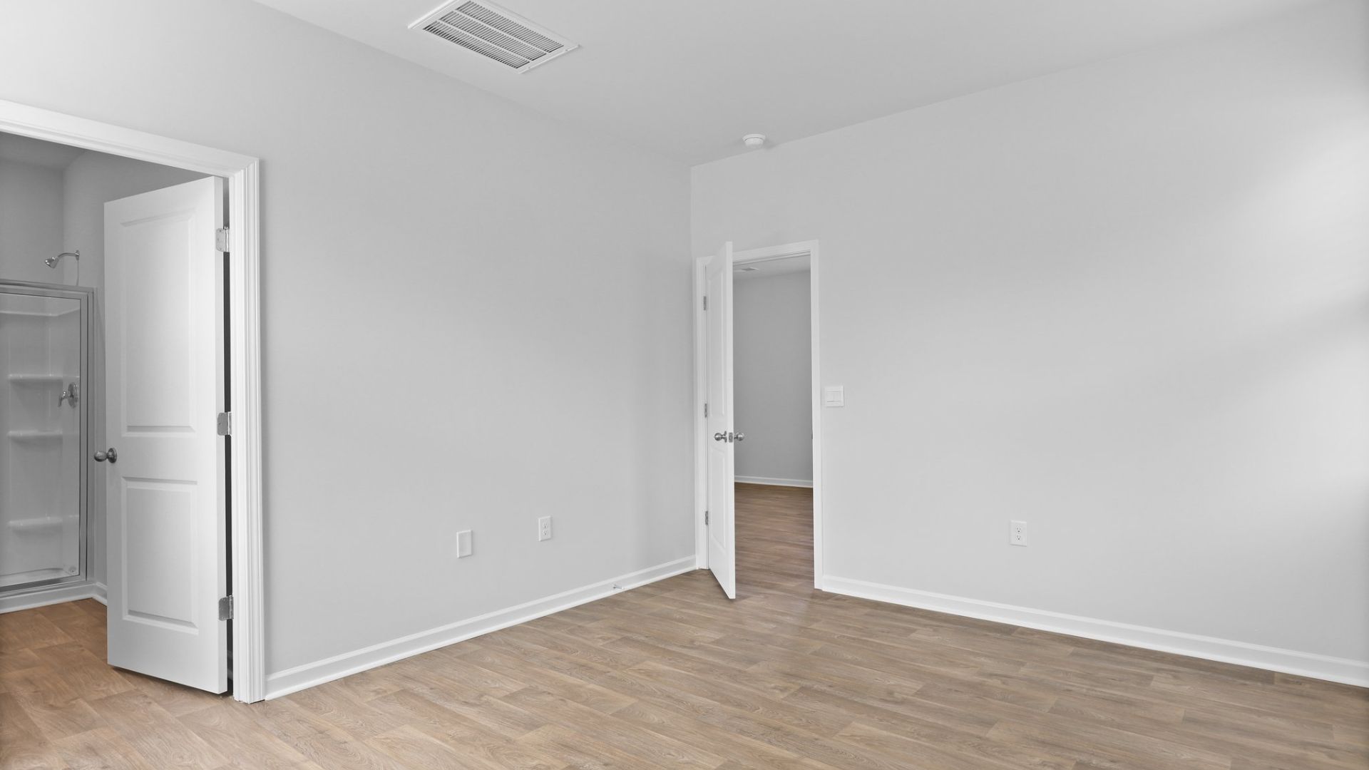 Ensuite walk-in closet and primary bathroom.