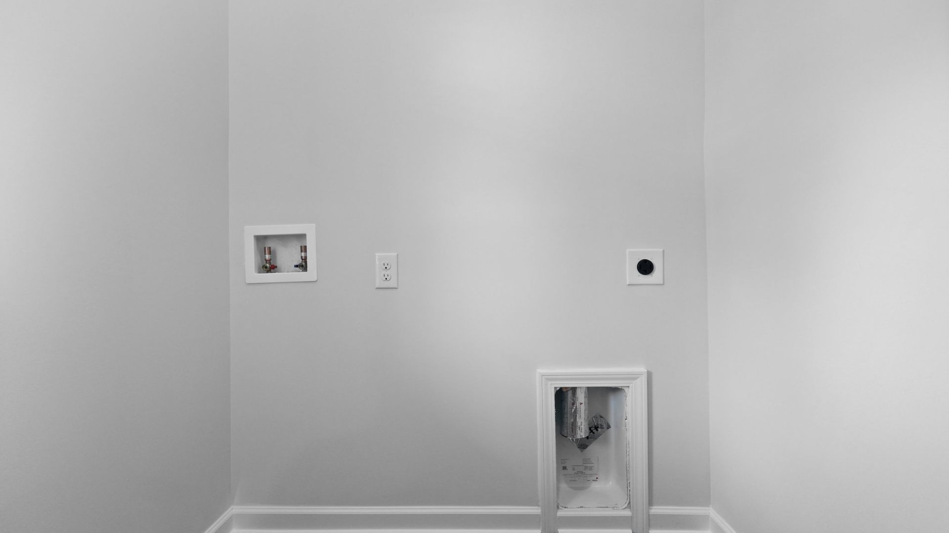 Laundry room located in the Perry floorplan.