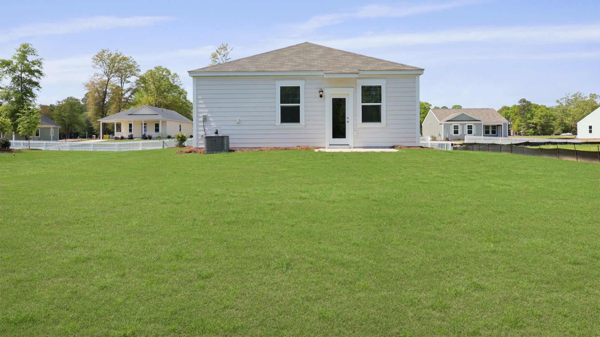 Spacious and bright backyard of the Perry cottage floorplan.