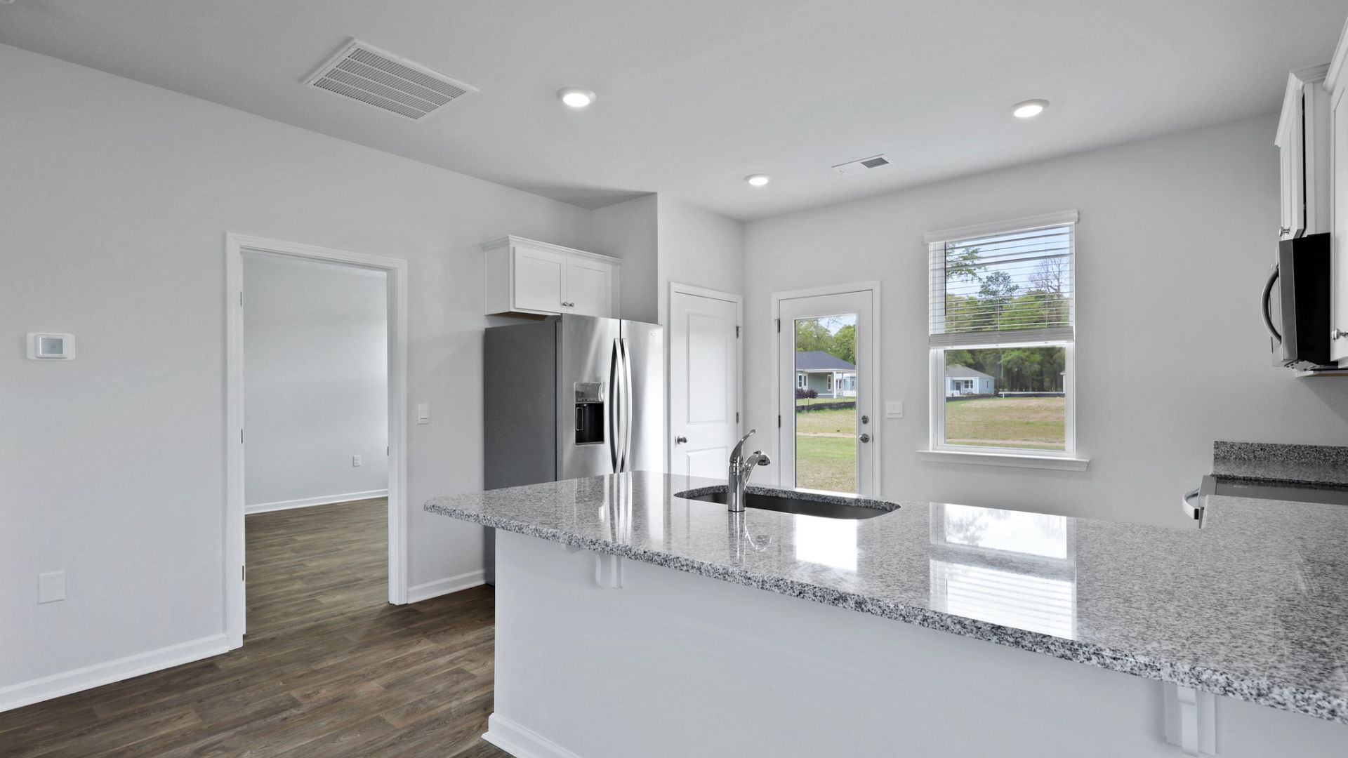 The peninsula can fit barstools underneath for seating.