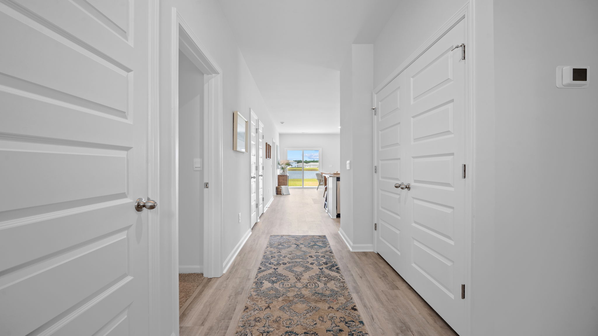 Welcoming foyer in the Greenbriar floor plan showcasing open sightlines, natural light, and contemporary finishes.