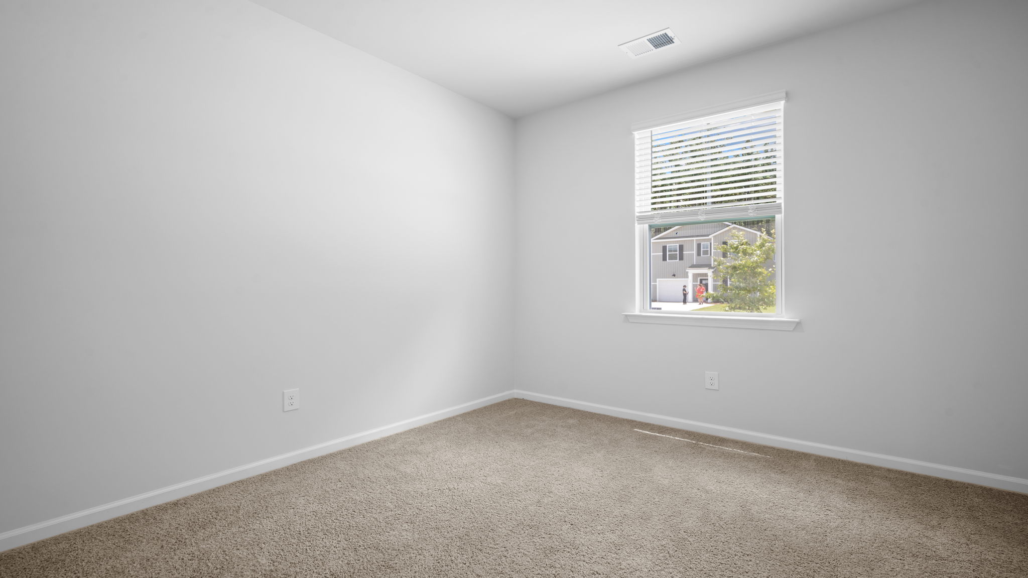 Secondary bedroom in the Greenbriar by D.R. Horton ideal for guests, family, or a home office