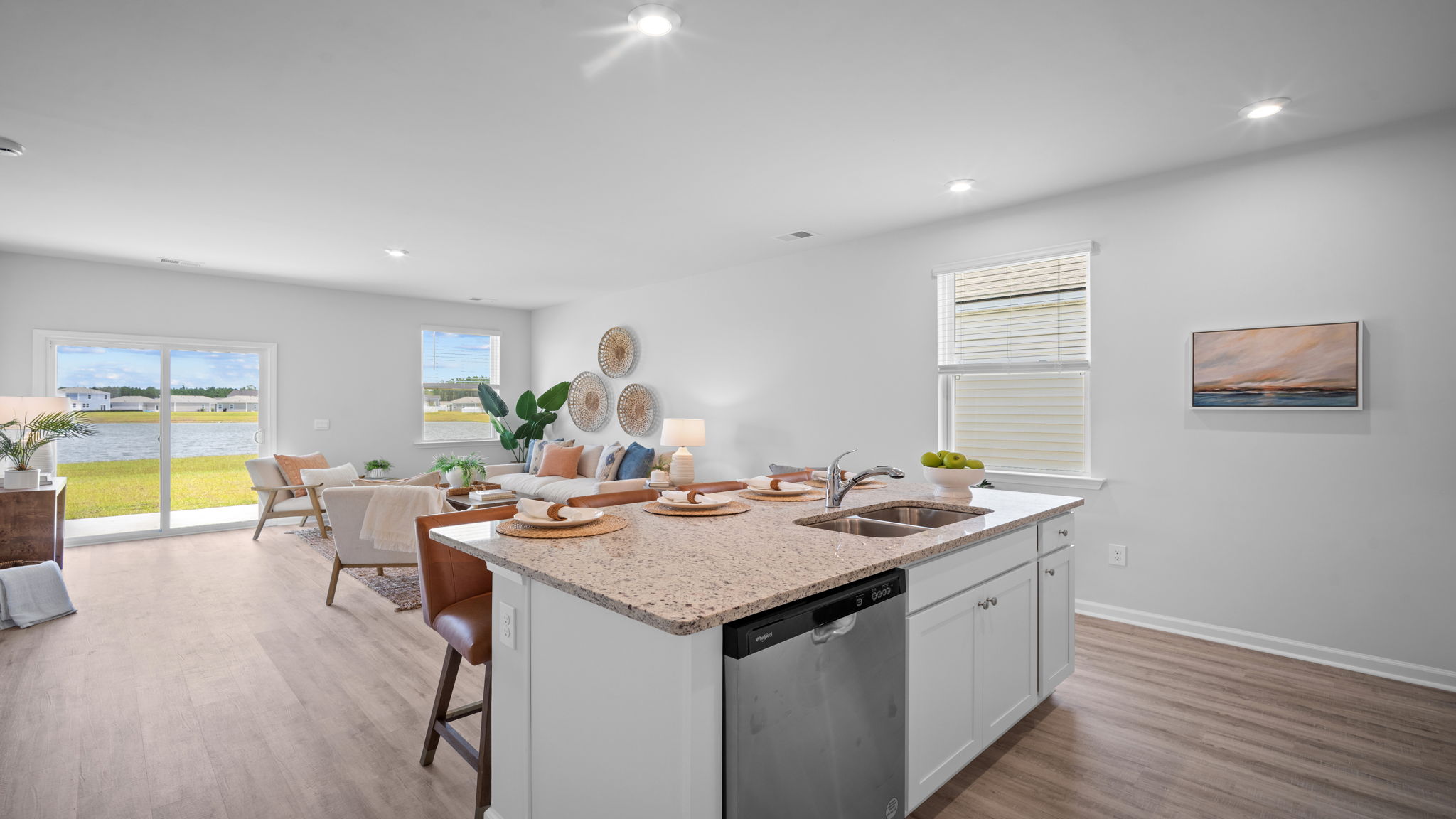 Contemporary kitchen in the D.R. Horton Greenbriar featuring a large center island and open-concept design