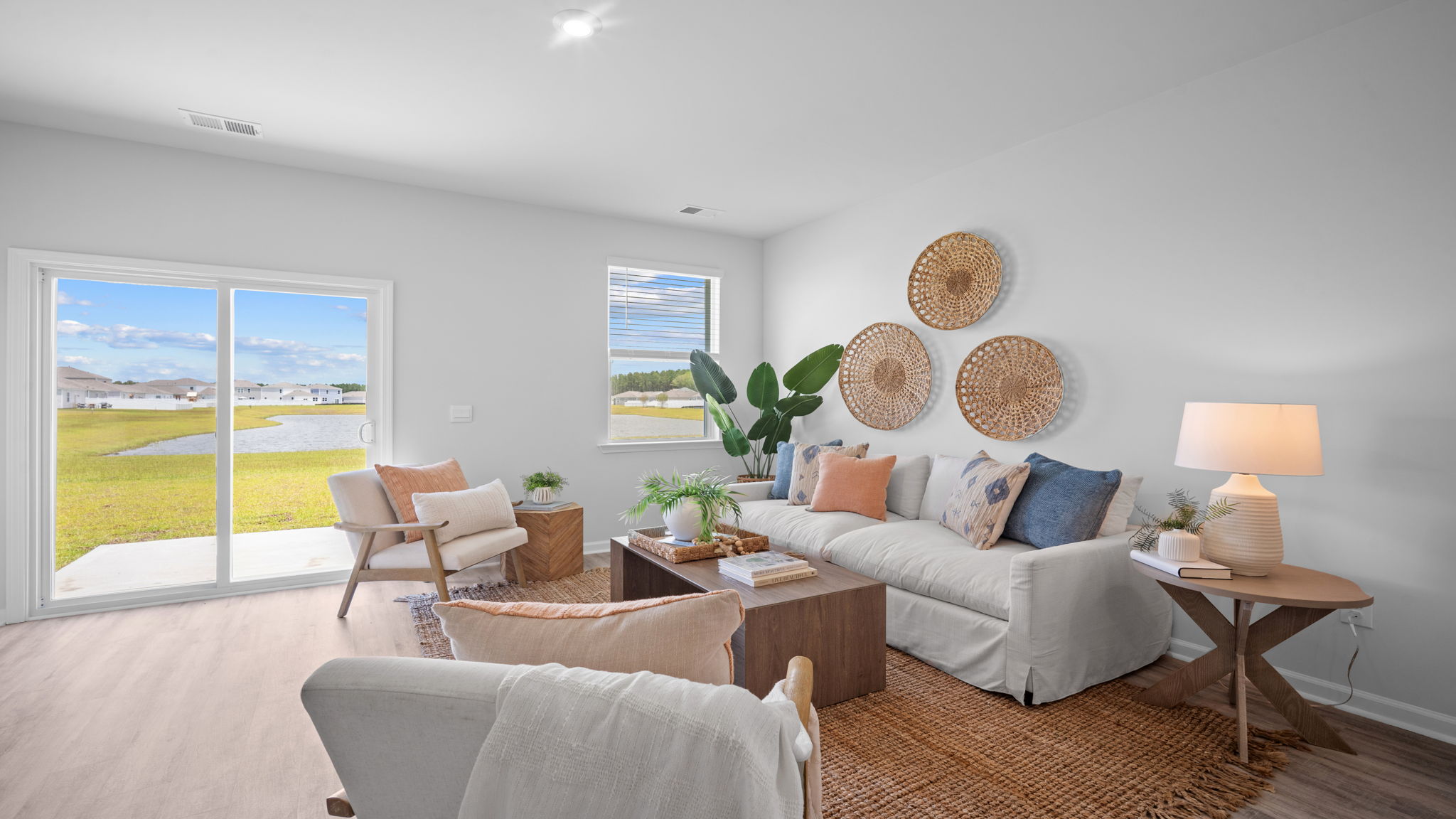 Open-concept living room in the D.R. Horton Greenbriar floor plan with natural light and spacious layout