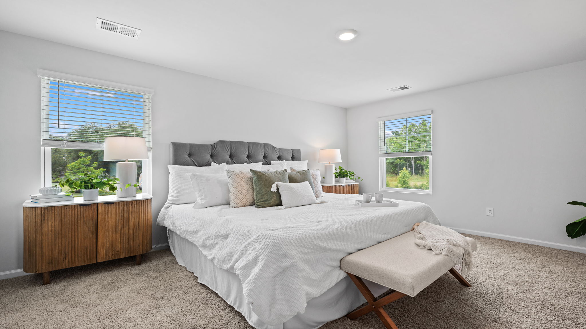 Private primary bedroom suite in the D.R. Horton Downing with spacious layout and peaceful setting