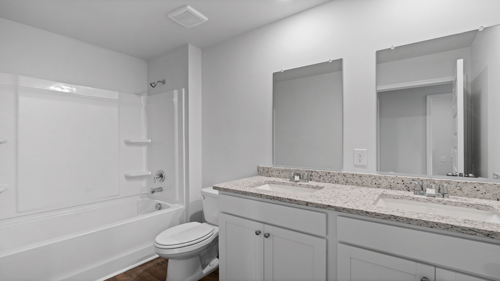 Full guest bathroom in the D.R. Horton Downing with modern fixtures and functional design