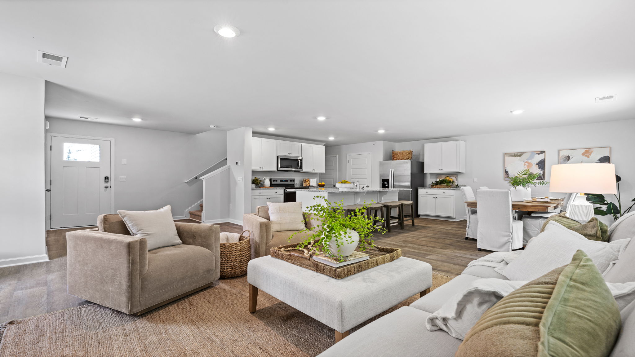 Bright family room in the Downing home connected to the kitchen and dining spaces
