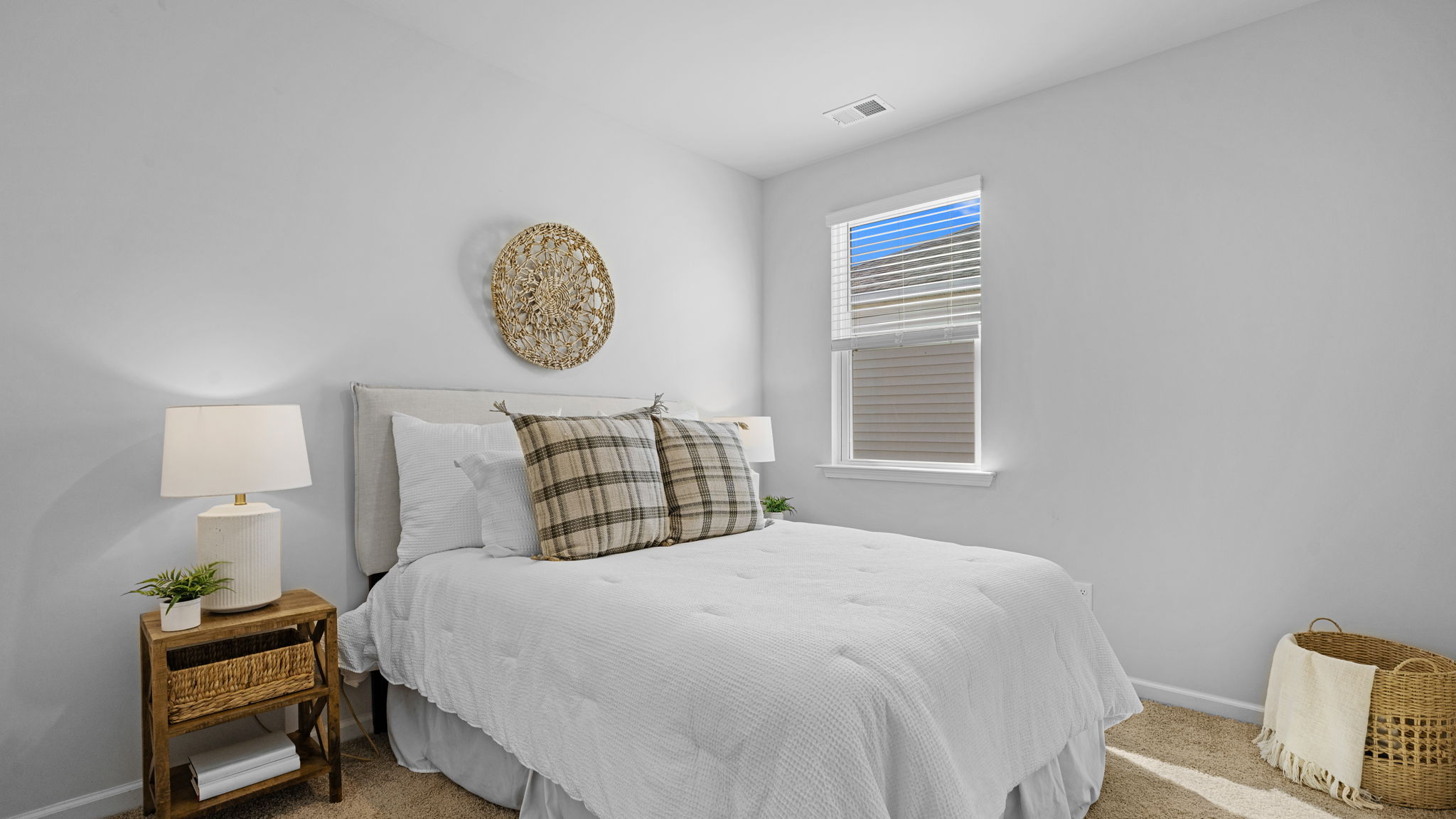 Guest bedroom with large windows