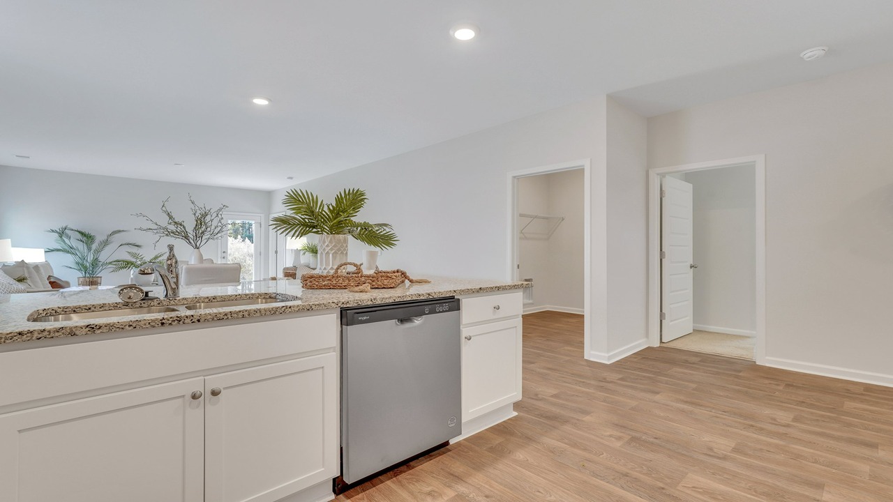Large center kitchen island in the Helena floor plan at East Argent featuring seating, storage, and open-concept design