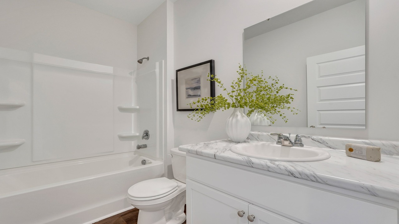 Modern guest bathroom in the Helena floor plan at East Argent featuring stylish finishes and functional design