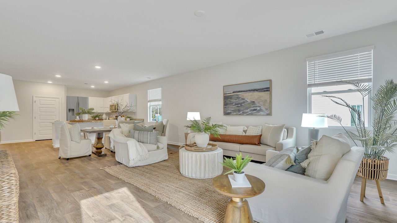 Spacious open-concept great room in the Helena floor plan at East Argent with abundant natural light and modern finishes