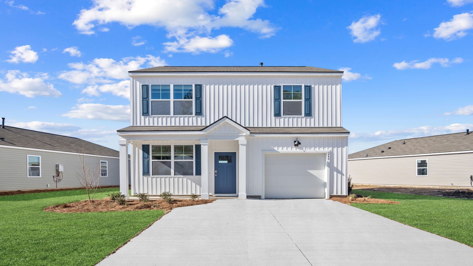 Brandon floor plan exterior by D.R. Horton featuring attractive curb appeal, professional landscaping, energy-efficient construction, and a two-car garage.