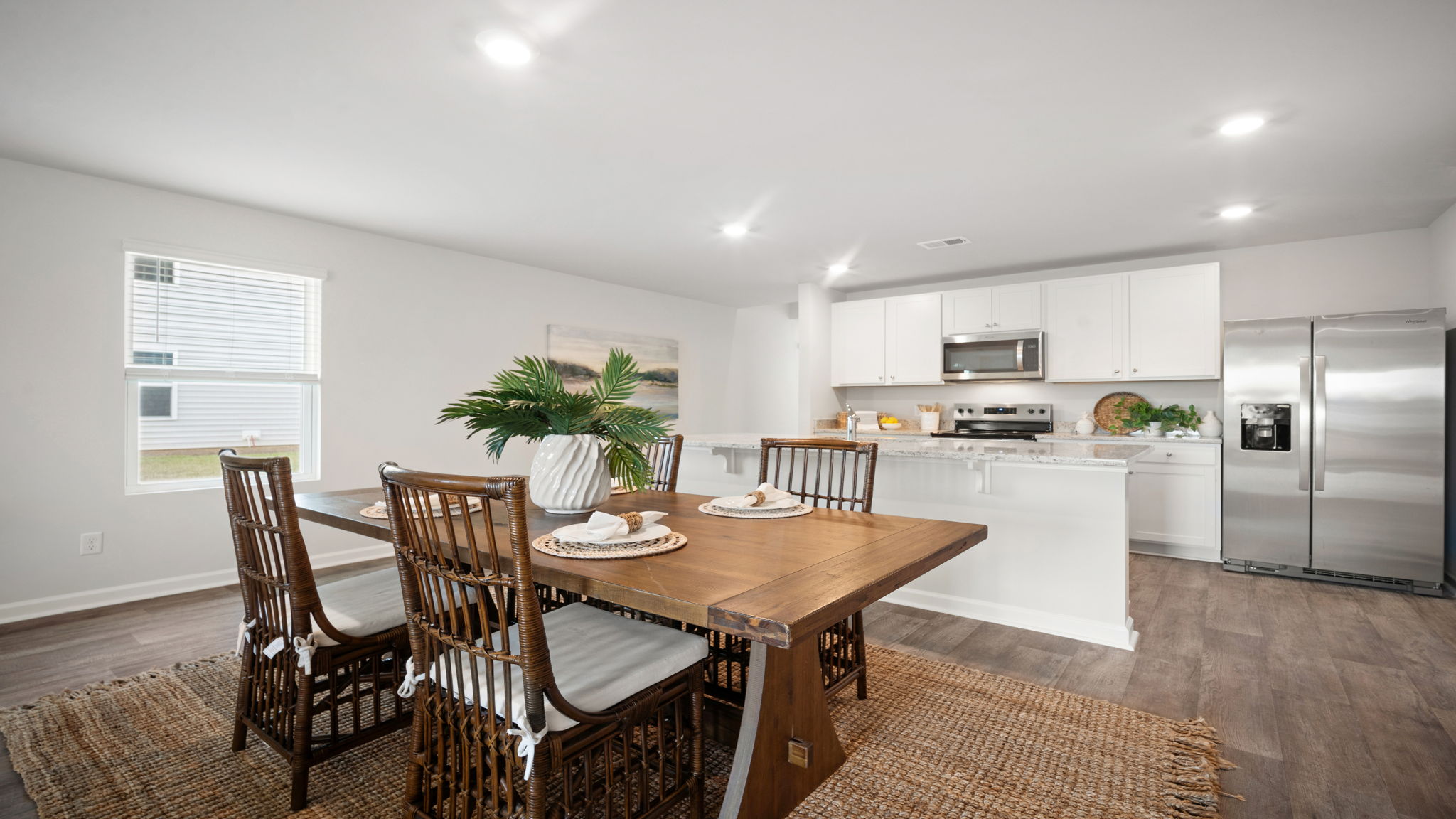 Dining area with the kitchen and living area adjacent.