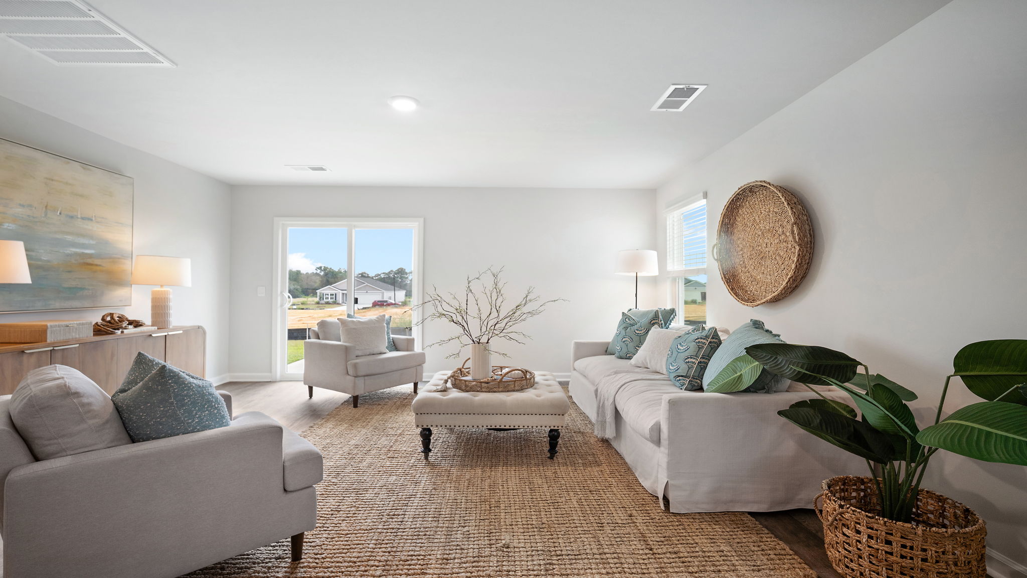 Living area with large windows for natural lighting.