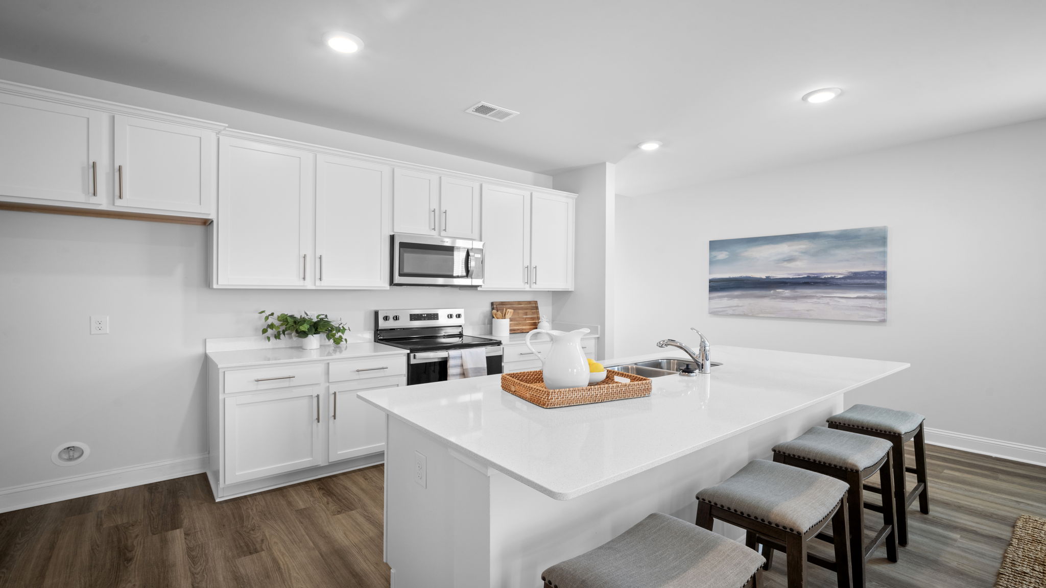 Spacious kitchen showcasing modern appliances, abundant storage, and entertaining space.