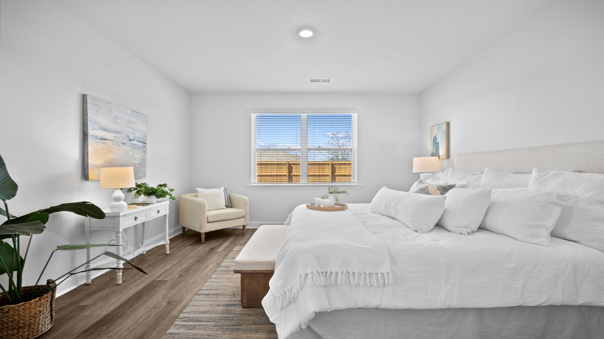 Large primary suite with room for a king-size bed and additional furnishings.