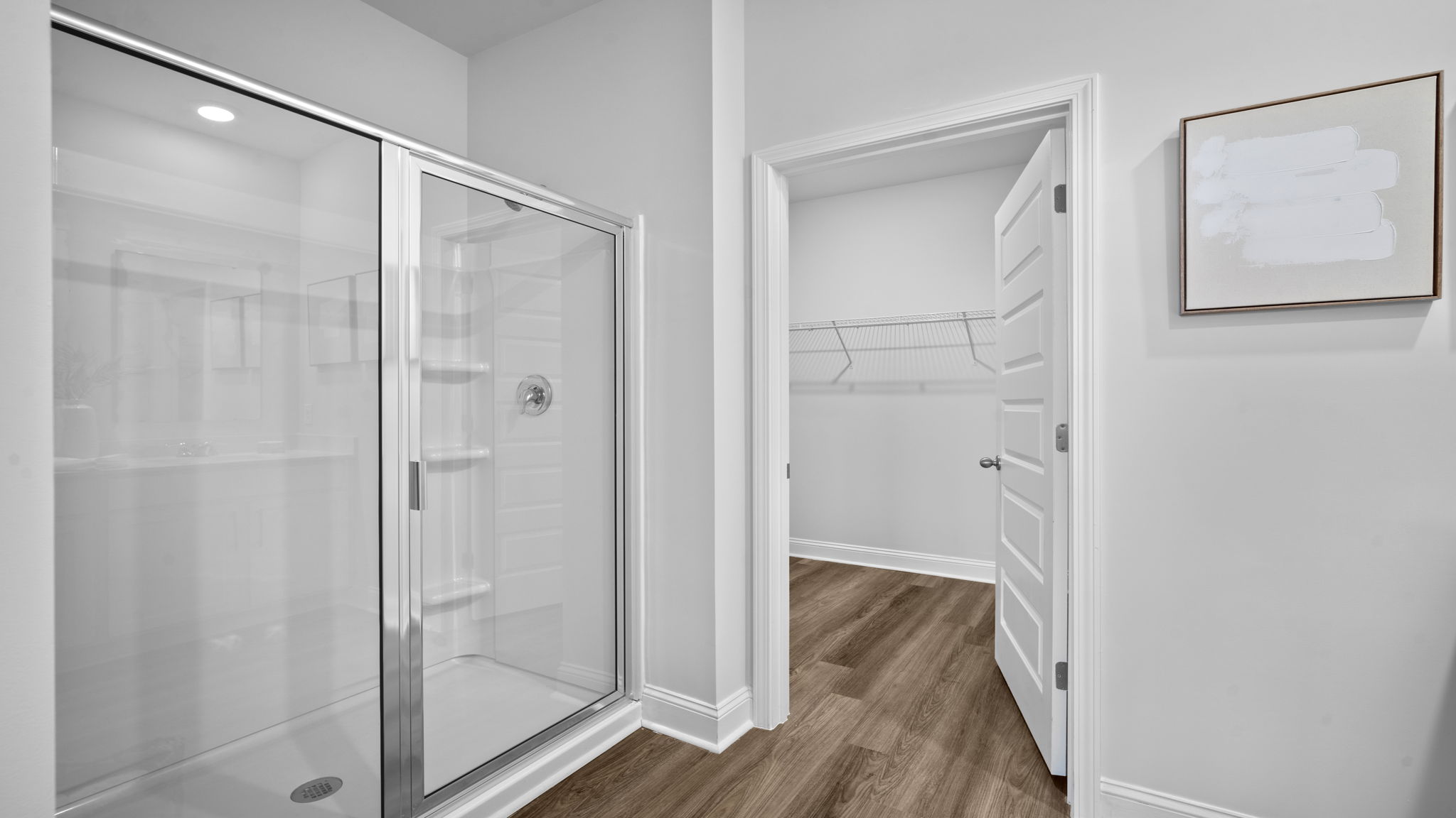 Luxurious primary bathroom featuring dual vanities and contemporary finishes.
