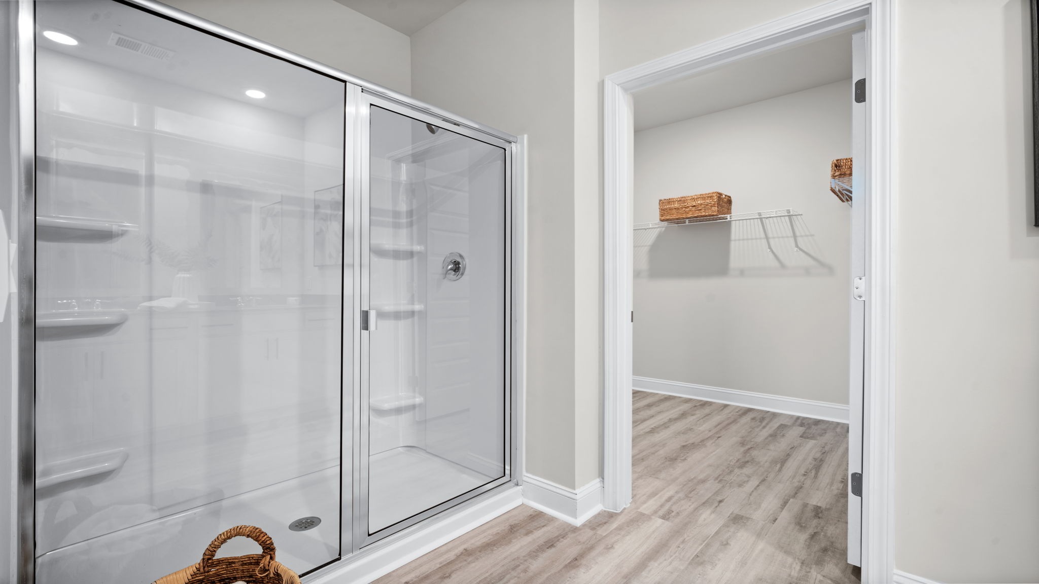 Primary bathroom in Manning model featuring dual vanities and modern finishes for everyday comfort