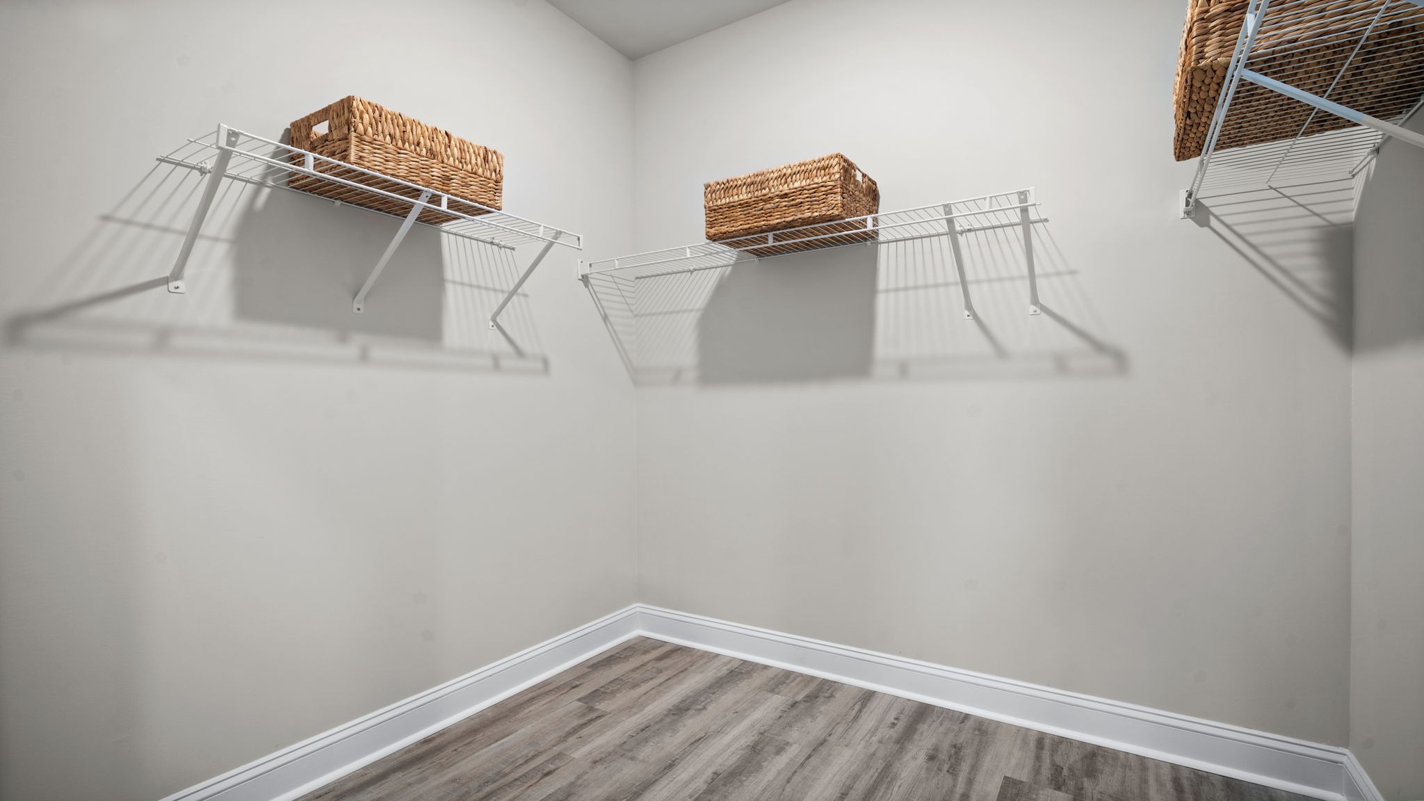 “Large walk-in closet in Manning primary suite offering ample storage and organization space.”
