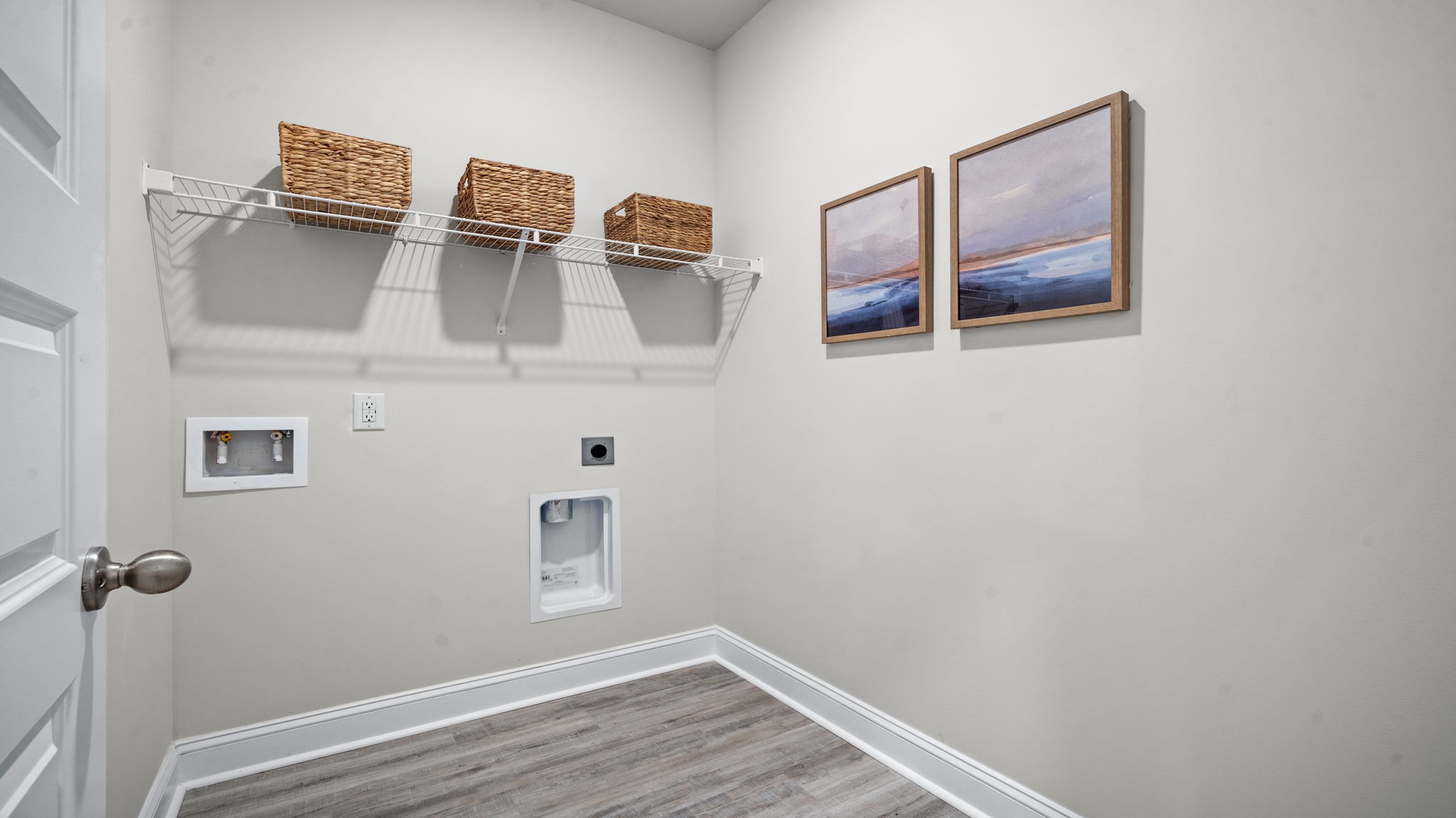 “Convenient laundry room in Manning DR Horton home designed for efficiency and easy household functionality.”