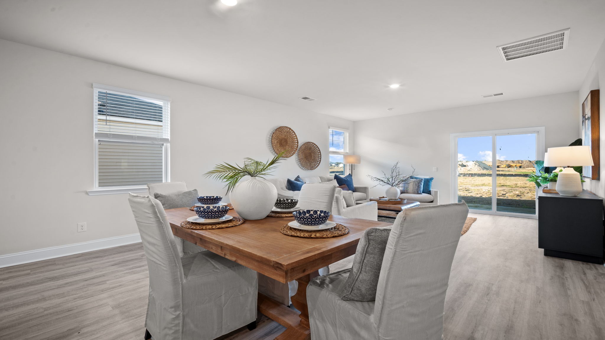 “Dining area in Manning floor plan with seamless flow to living room and kitchen in East Argent Ridgeland SC.”
