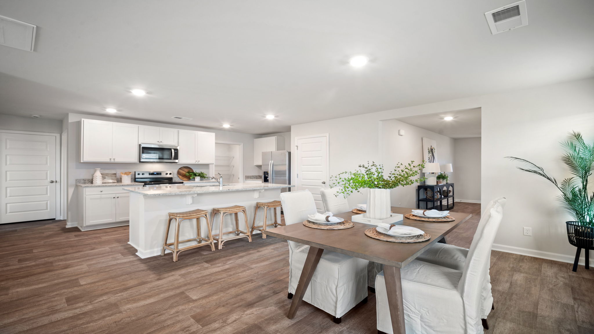 Open‑concept kitchen in D.R. Horton Robie home connecting to dining and living areas for entertaining