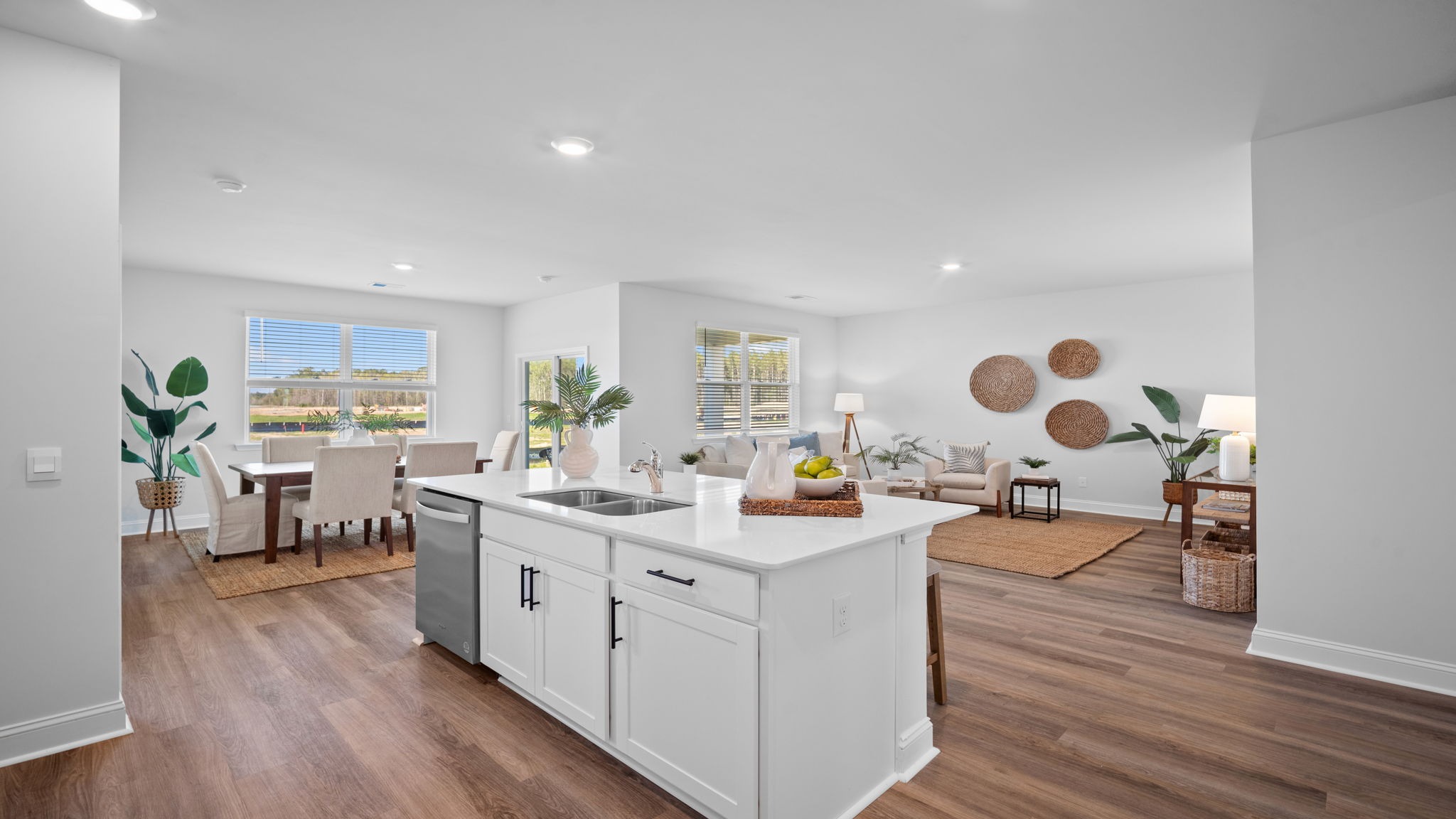 Kitchen island open concept view of the dining and living area